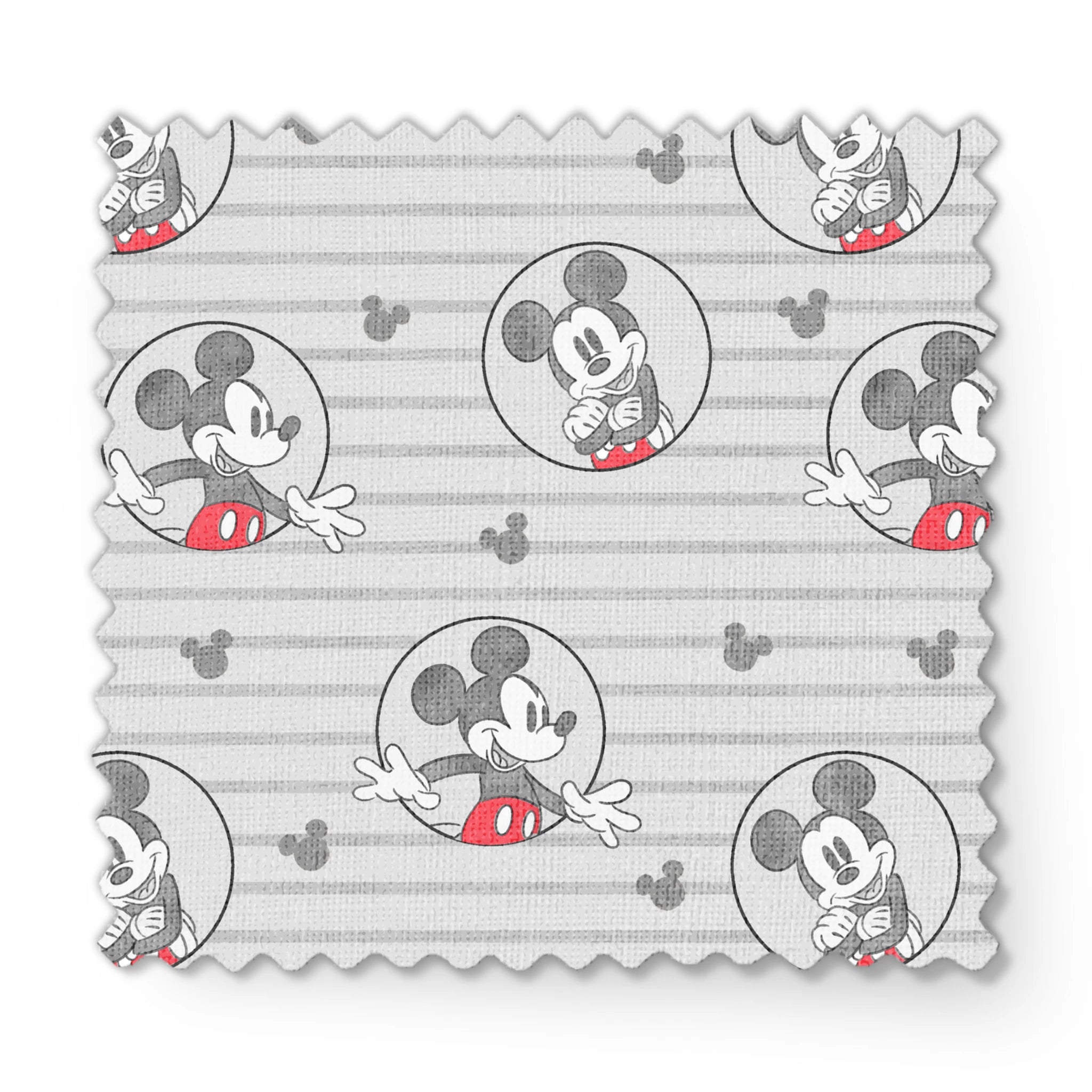Mickey Mouse pattern on gray striped background with circular character portraits in red, black, and white fabric swatch mockup