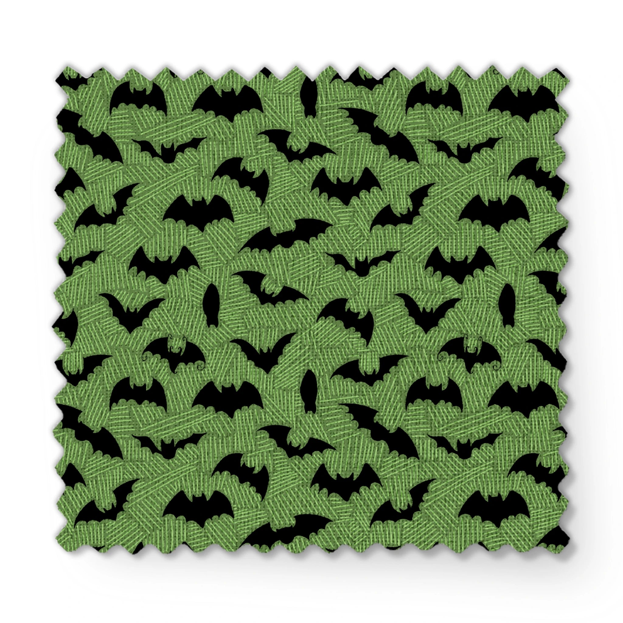 Black bat silhouettes scattered across a green textured background with zigzag pattern fabric swatch mockup