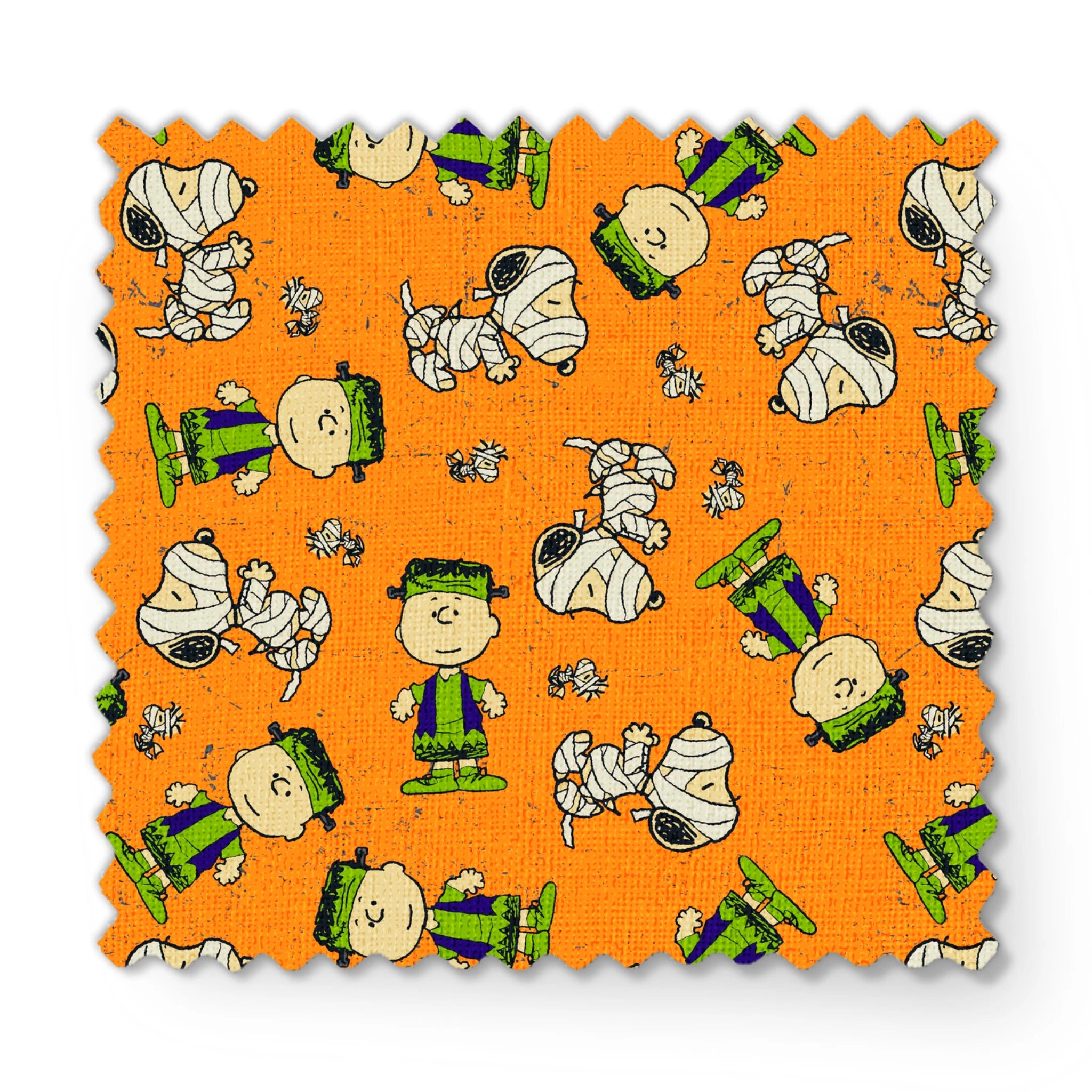 Peanuts characters pattern on orange background with Charlie Brown, Snoopy, and friends scattered throughout fabric swatch mockup