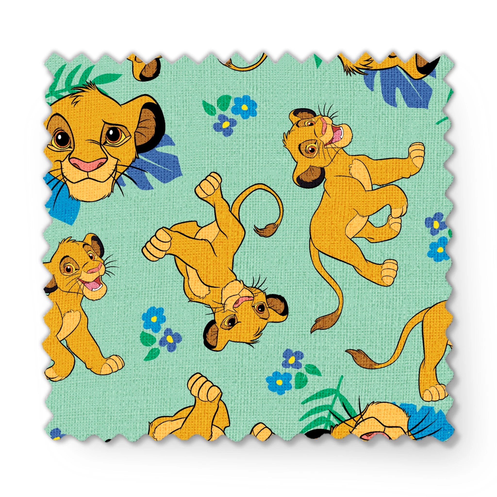 Cartoon lion cubs playing on mint green background with blue flowers and green leaves pattern fabric swatch mockup