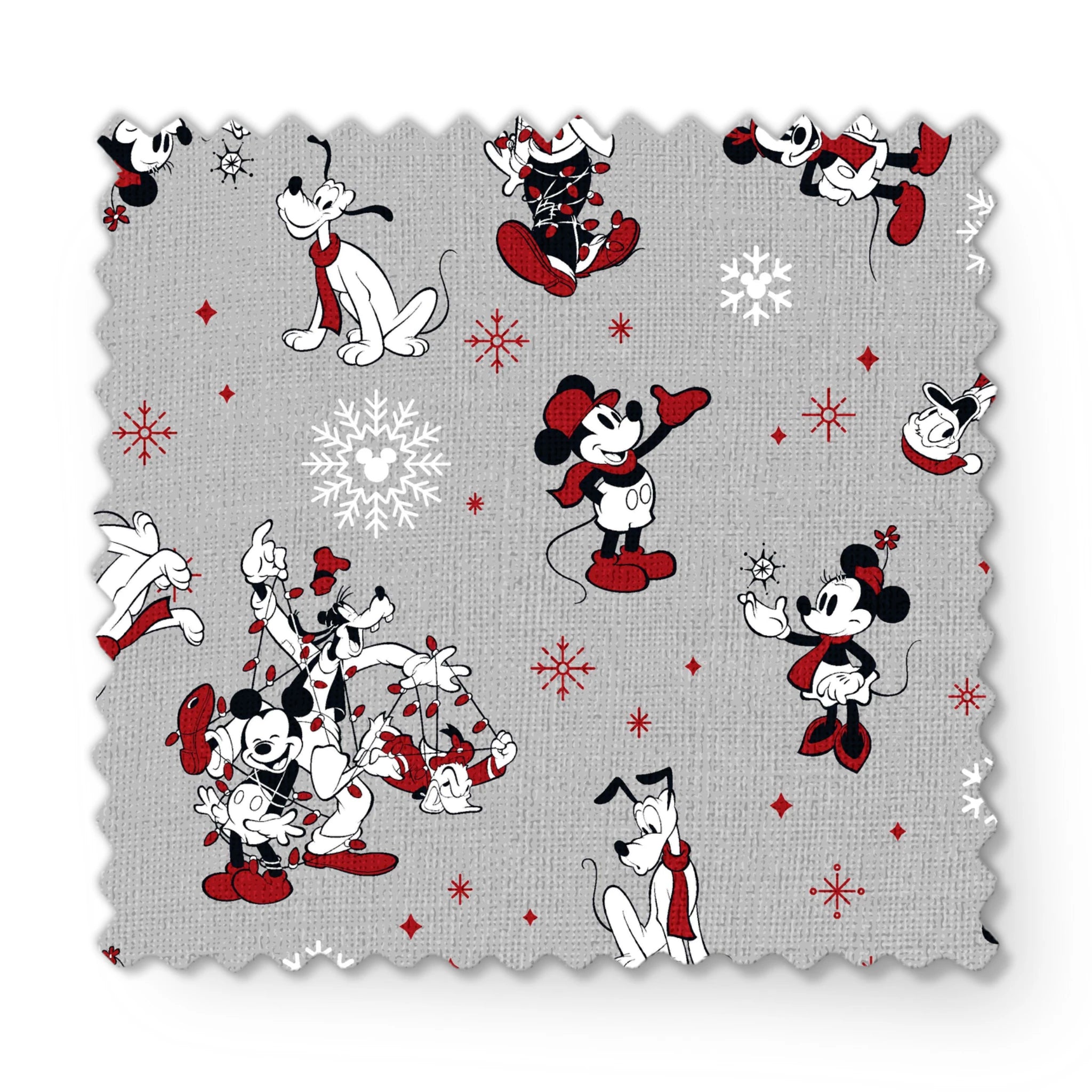 Mickey and Minnie Mouse characters in winter attire with snowflakes on gray background fabric swatch mockup