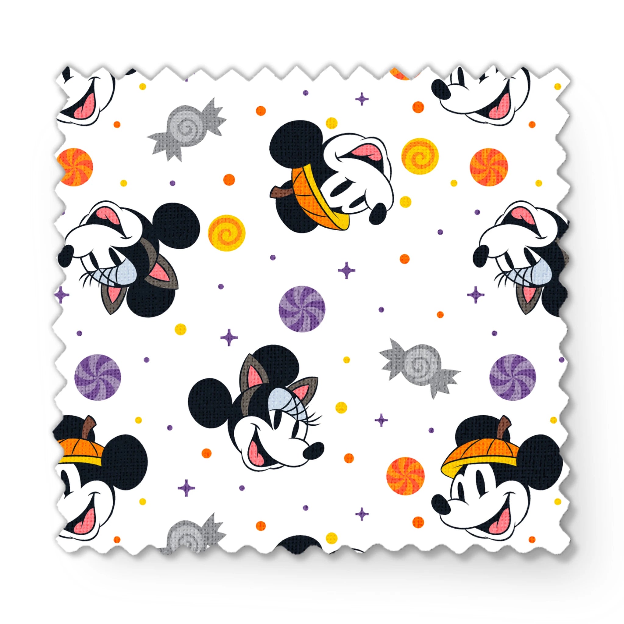 Mickey and Minnie Mouse cartoon heads scattered with wrapped candies and colorful dots on white background fabric swatch mockup