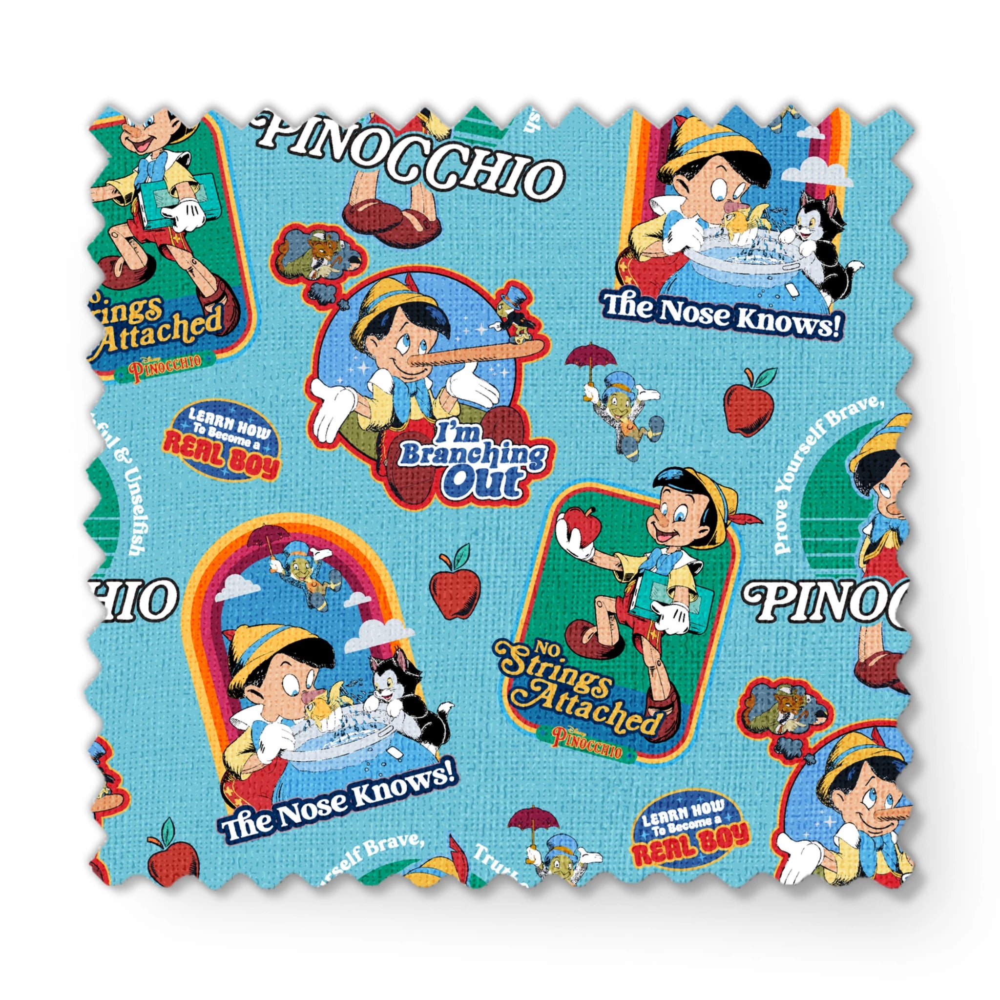 Colorful Pinocchio cartoon pattern featuring puppet characters, slogans, and red apples on teal background fabric swatch mockup