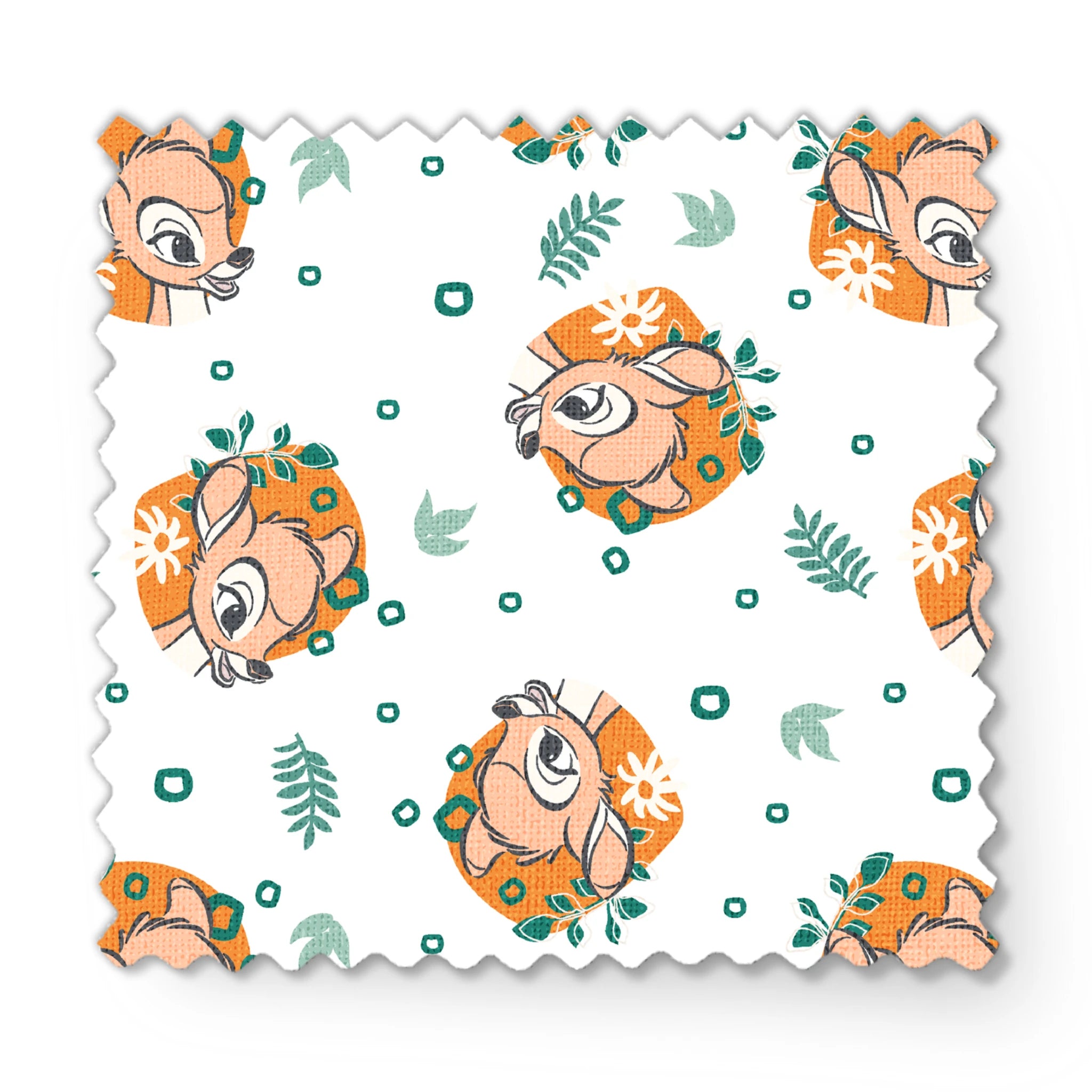 Disney’s Bambi illustrated in golden-orange floral medallions with green leaves and scattered geometric accents on a white background. fabric swatch mockup