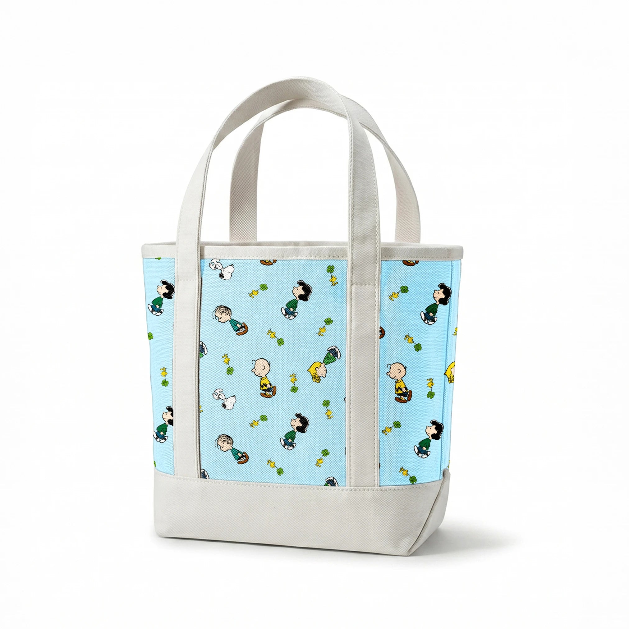 Peanuts cartoon characters on light blue background with clovers springs canvastote mockup
