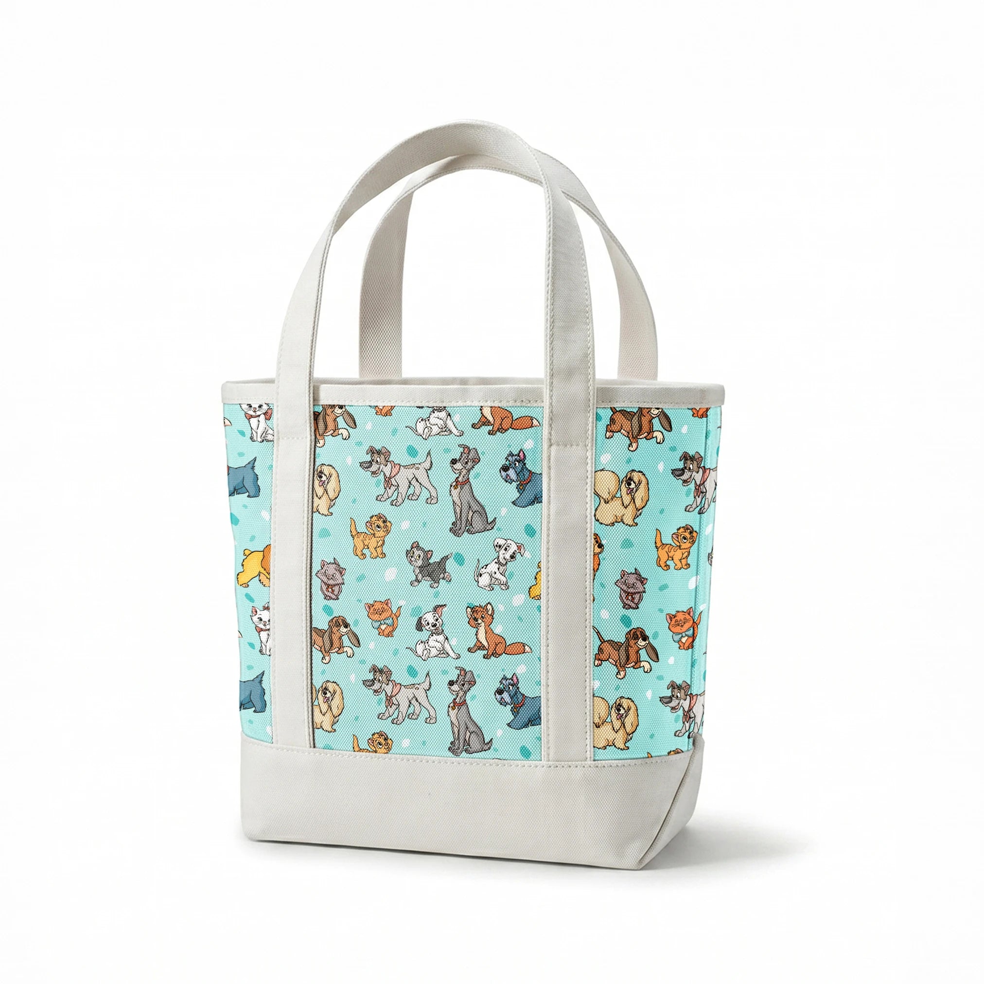 Cartoon-style Disney dogs and cats on a light blue background with scattered spots. springs canvastote mockup