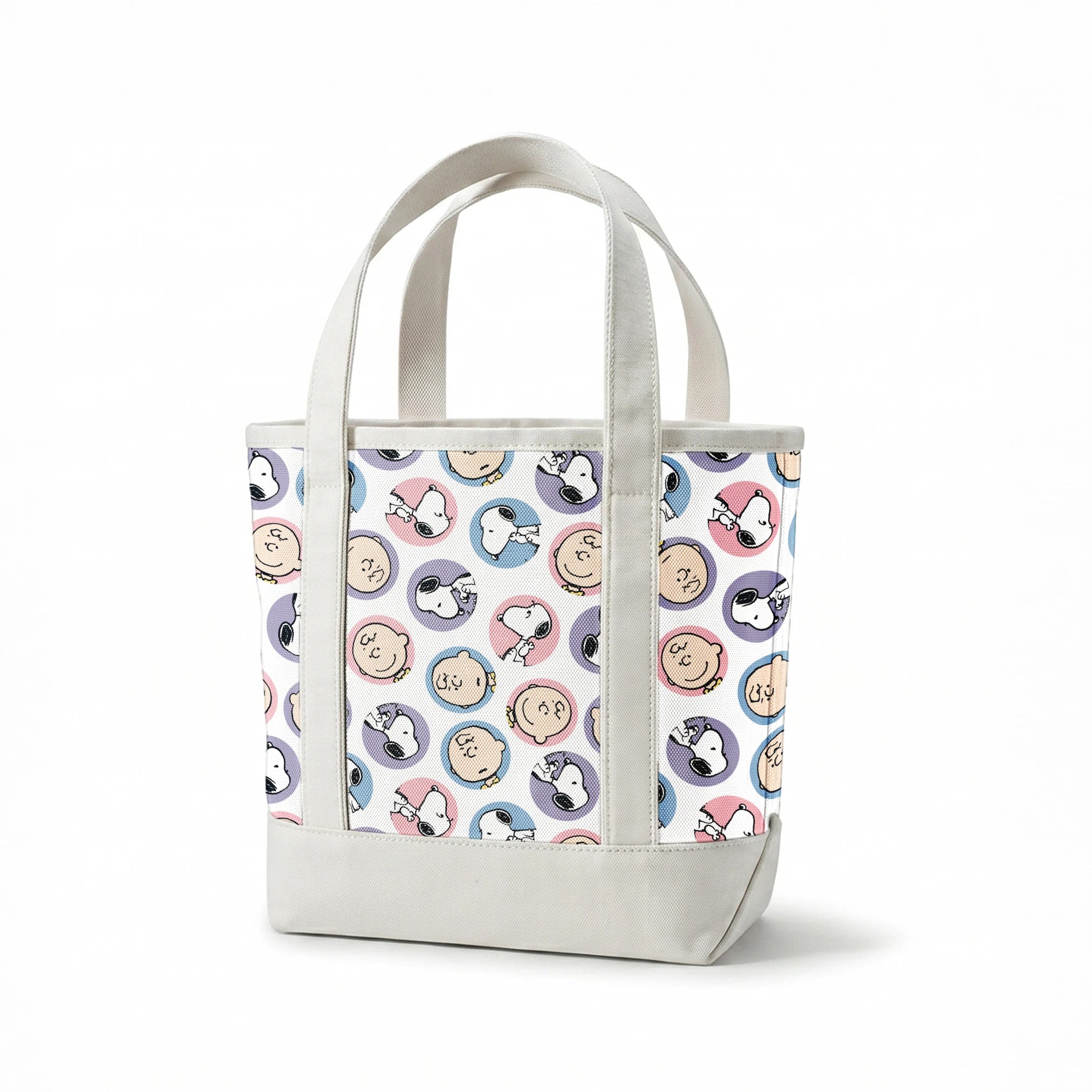 Peanuts cartoon pattern with Charlie Brown and Snoopy circular portraits in pink, blue and purple springs canvastote mockup