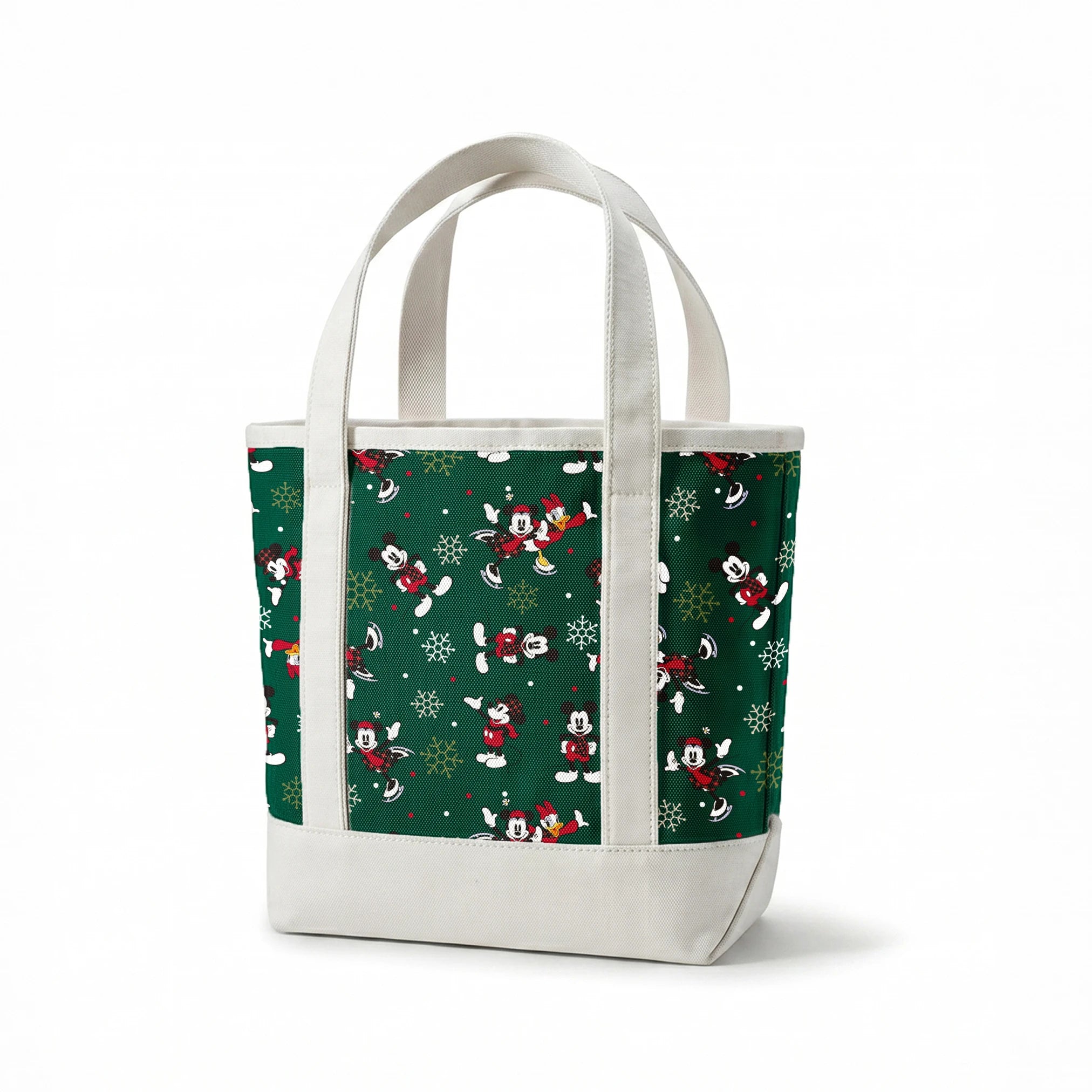 Mickey Mouse Christmas pattern with cartoon characters in winter outfits on green background with snowflakes springs canvastote mockup