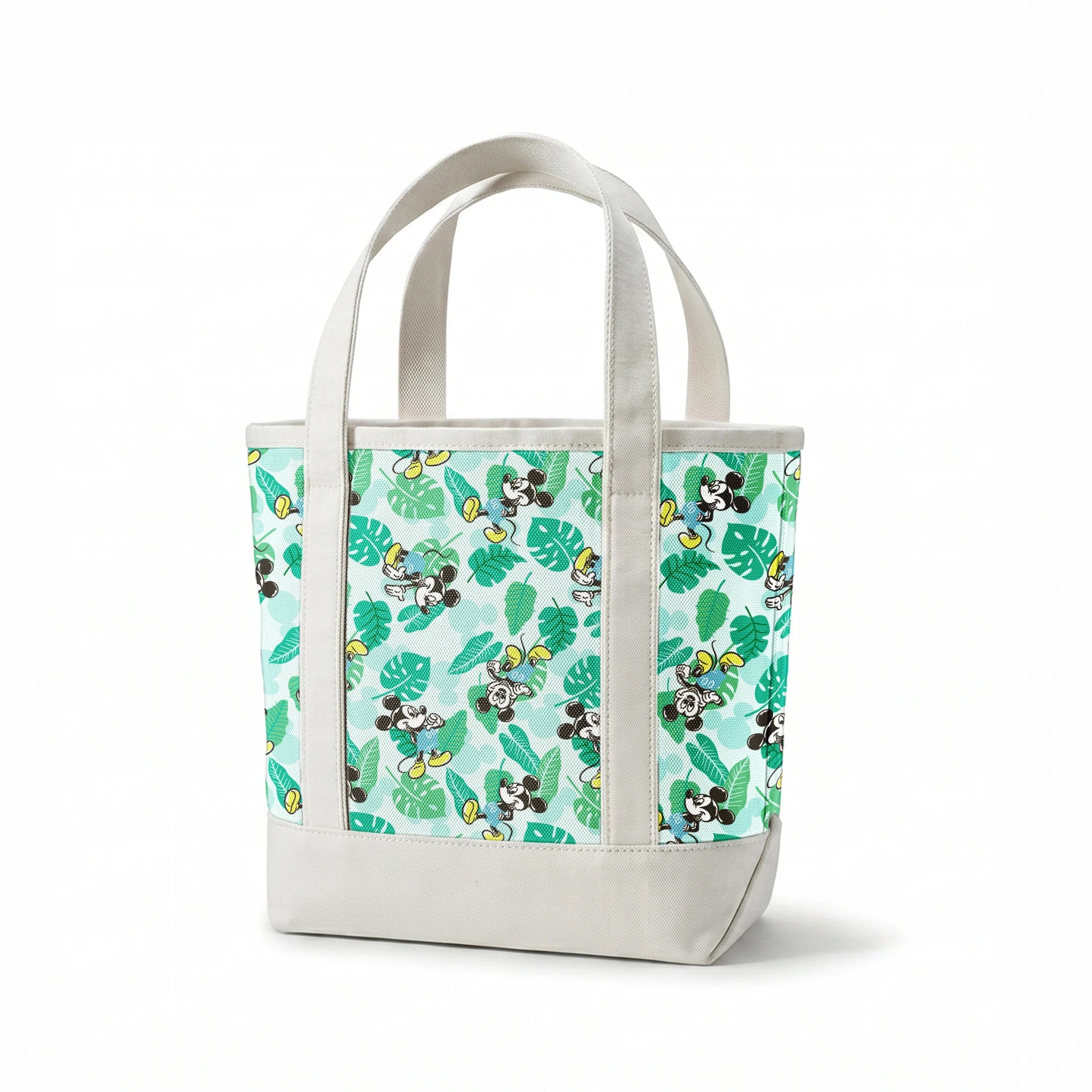 Colorful pattern with cartoon mice characters and tropical green leaves on a light blue background springs canvastote mockup