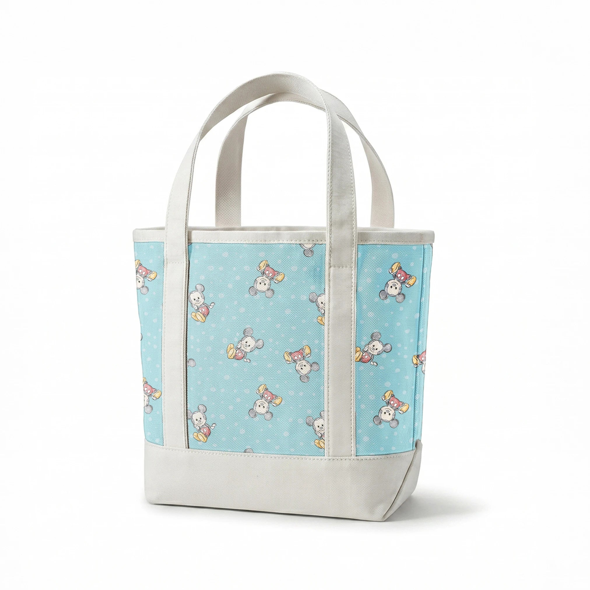Cute cartoon mouse pattern with gray mice wearing colorful outfits on light blue polka dot background springs canvastote mockup