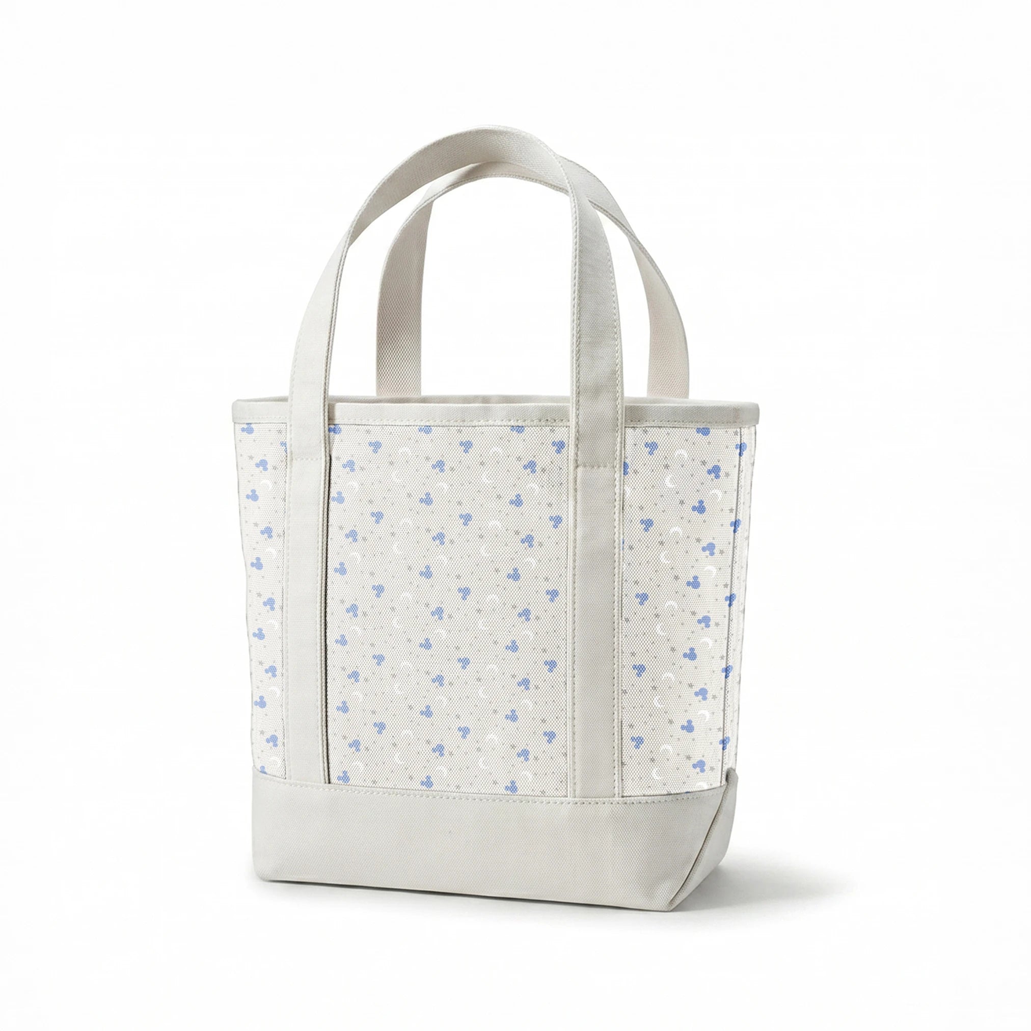 Blue Mickey Mouse silhouettes with white moons and gray stars on light gray background springs canvastote mockup