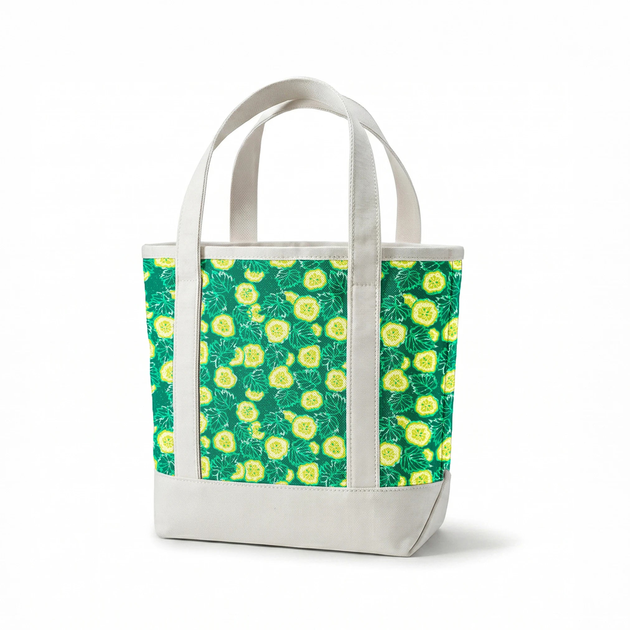 Vibrant green background with yellow cucumber slices and light green leafy patterns springs canvastote mockup