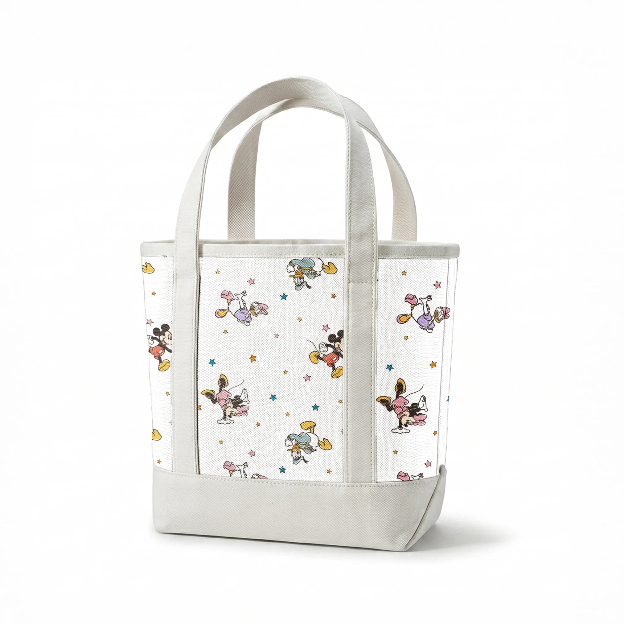 Disney characters pattern with Mickey Mouse and unicorns on white background with colorful stars springs canvastote mockup