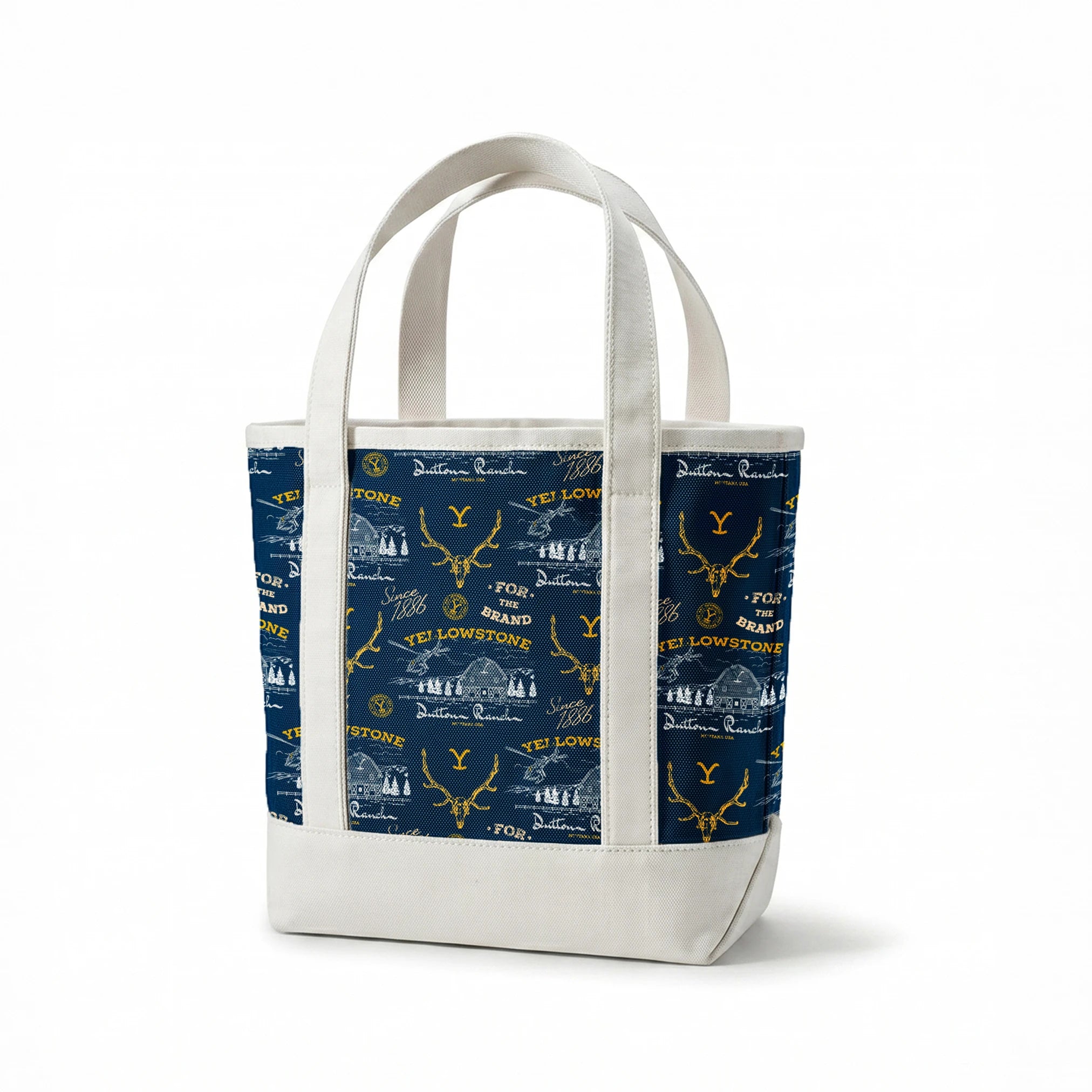 Yellowstone-themed pattern with Dutton Ranch logos, deer antlers, and "Y" branding on navy blue background springs canvastote mockup