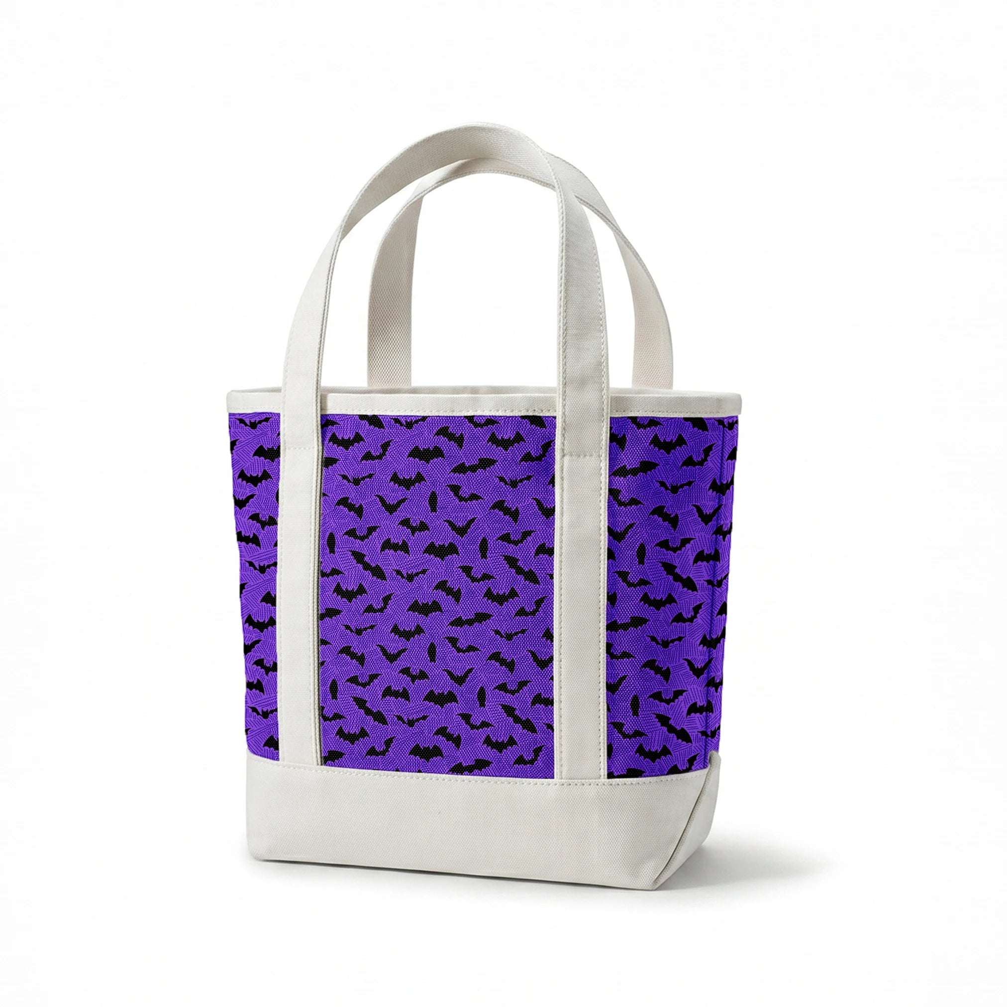 Black bat silhouettes scattered over purple zigzag background, Halloween-themed pattern springs canvastote mockup