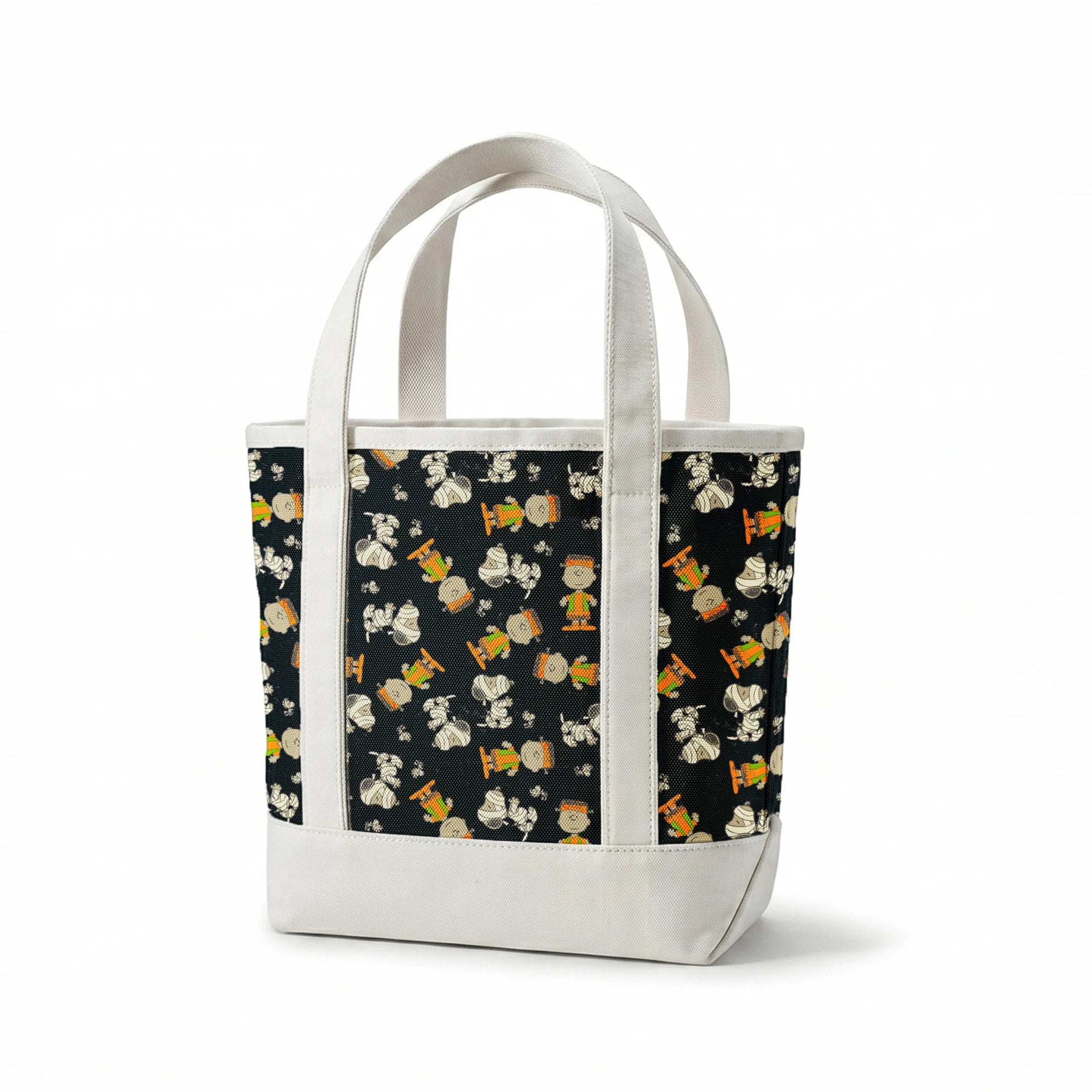 Peanuts characters pattern on black background featuring Snoopy and Charlie Brown in fall outfits springs canvastote mockup