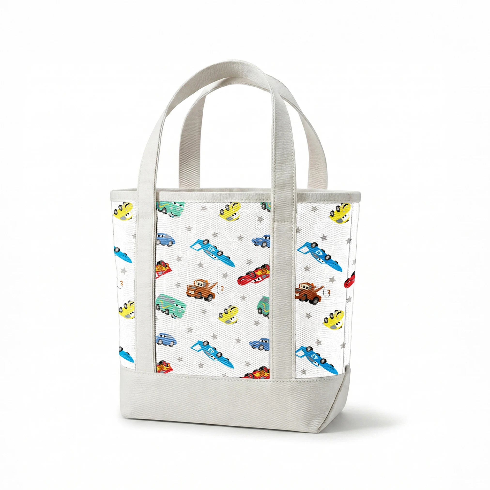Cartoon vehicles pattern with colorful cars, trucks, and racing cars on white background with gray stars springs canvastote mockup