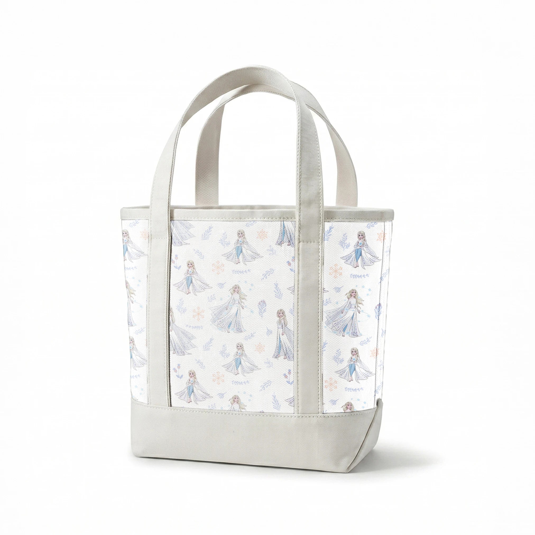 The image shows a decorative pattern featuringFrozen's Elsa, surrounded by delicate snowflakes, leaves, and floral elements in soft pastel colors on a light background. springs canvastote mockup