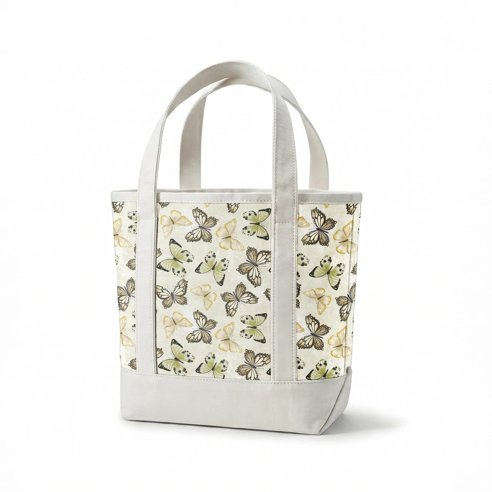 Illustrated butterfly pattern by Nicole Tamarin with soft sage green and neutral tones on a textured cream background. springs canvastote mockup