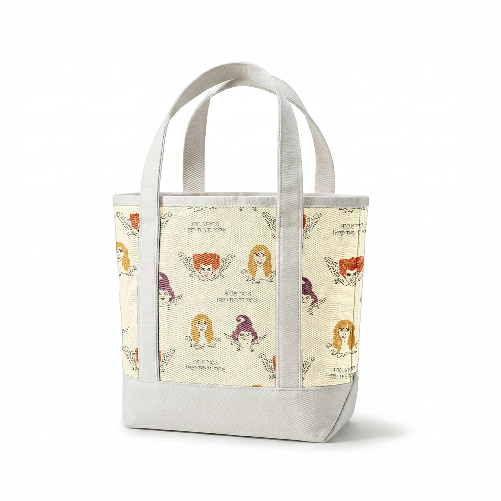 Pattern of illustrated magical characters with orange, blonde and purple hair on cream background with "Hocus Pocus" text springs canvastote mockup