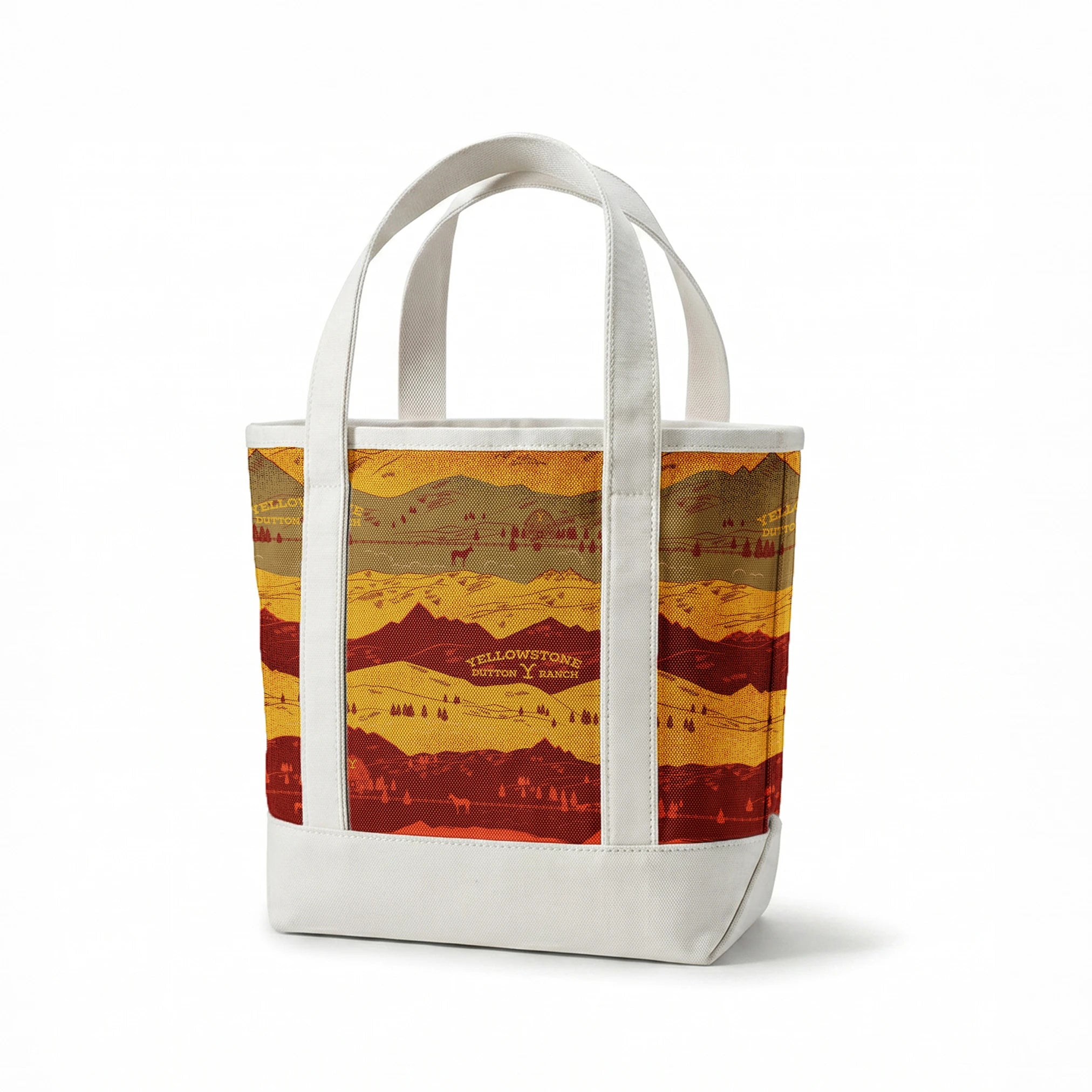 Layered mountain landscape in red, gold, and brown with "Yellowstone Cotton Ranch" text and silhouetted trees and wildlife. springs canvastote mockup