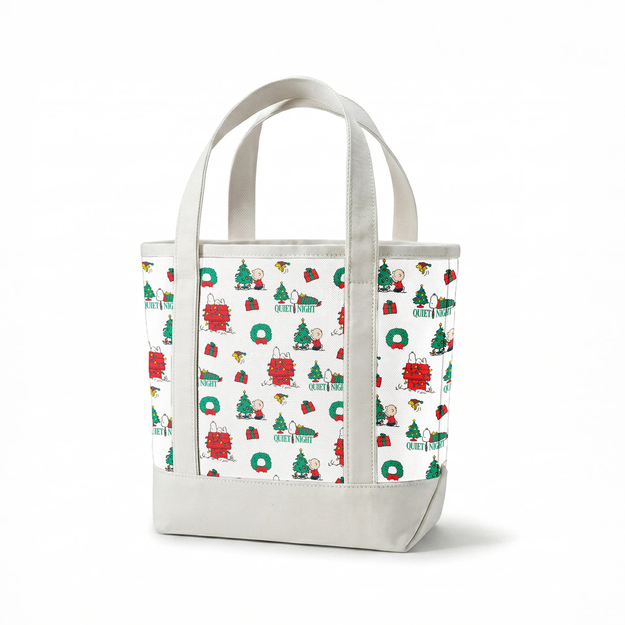 Peanuts Christmas pattern with Snoopy's decorated doghouse, trees, wreaths, and "Quiet Night" text springs canvastote mockup