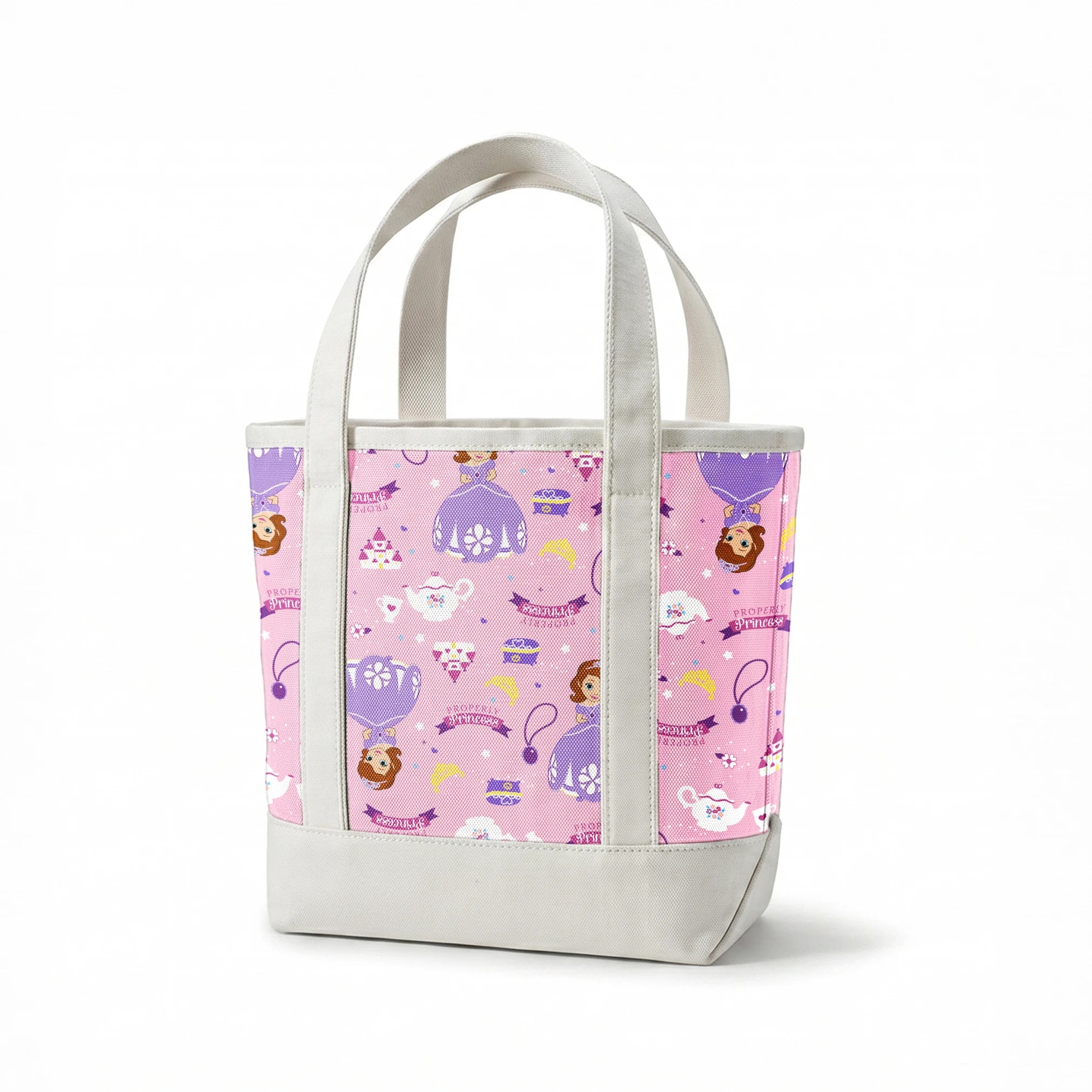 Princess-themed pattern with purple dresses, tiaras, teapots, and banners on pink background springs canvastote mockup