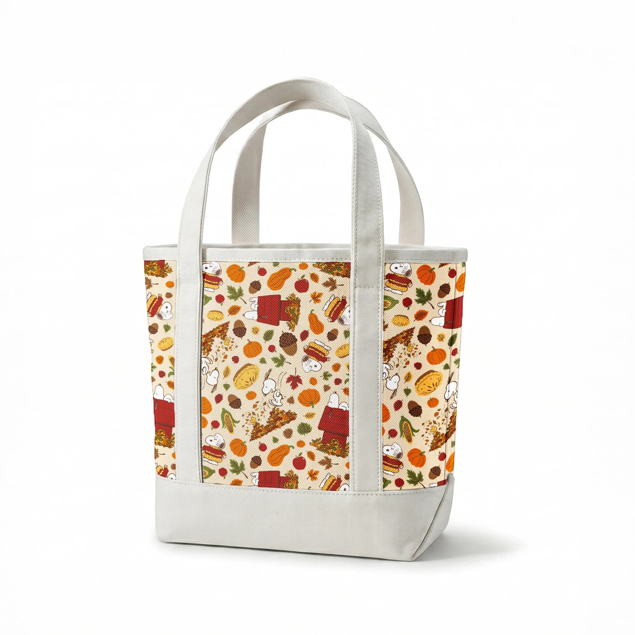 Fall themed pattern with Snoopy, red doghouses, pumpkins, corn, sandwiches, and autumn leaves on cream background springs canvastote mockup