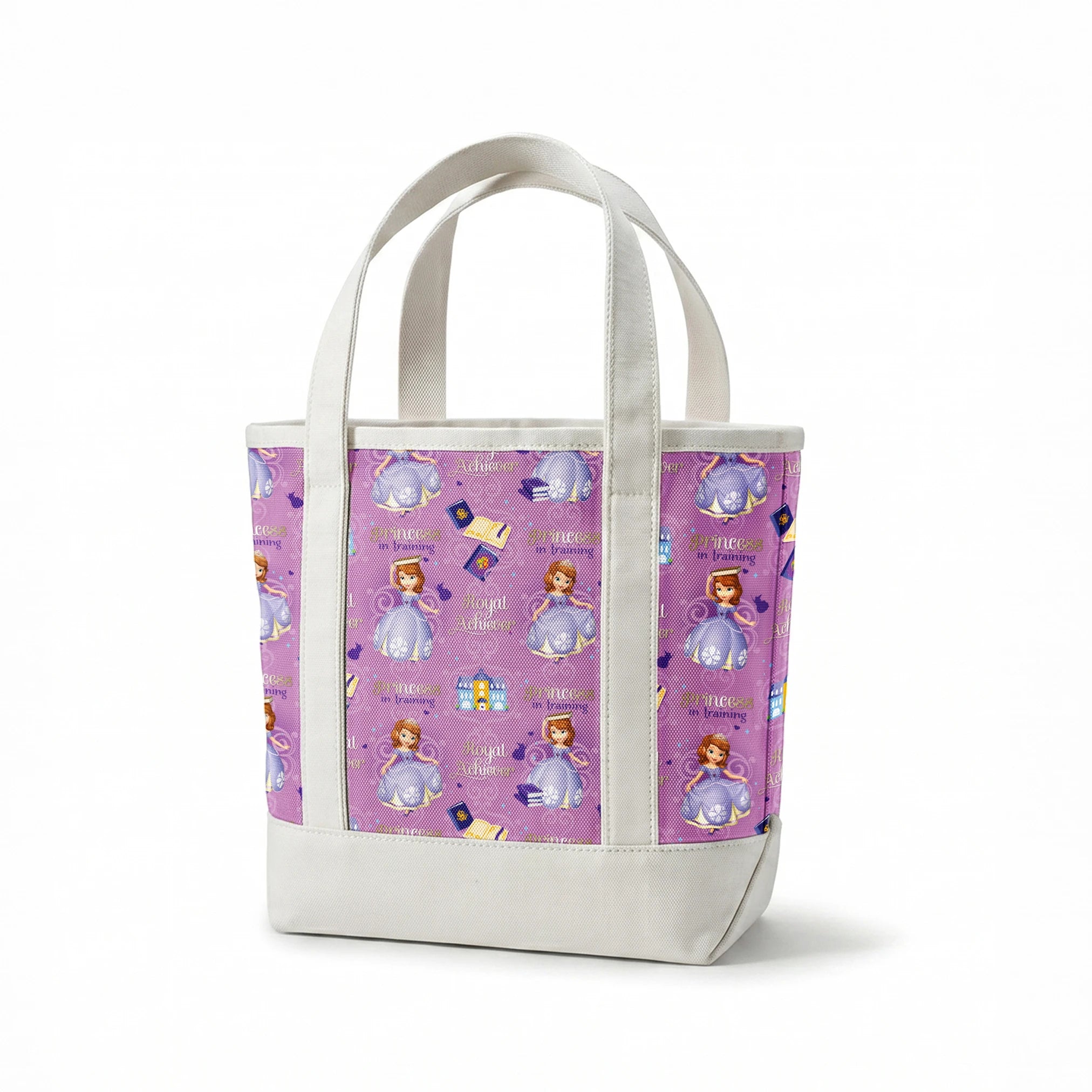 Princess Sofia pattern with "Royal Achiever" and "Princess in Training" text, purple background with castles and books springs canvastote mockup
