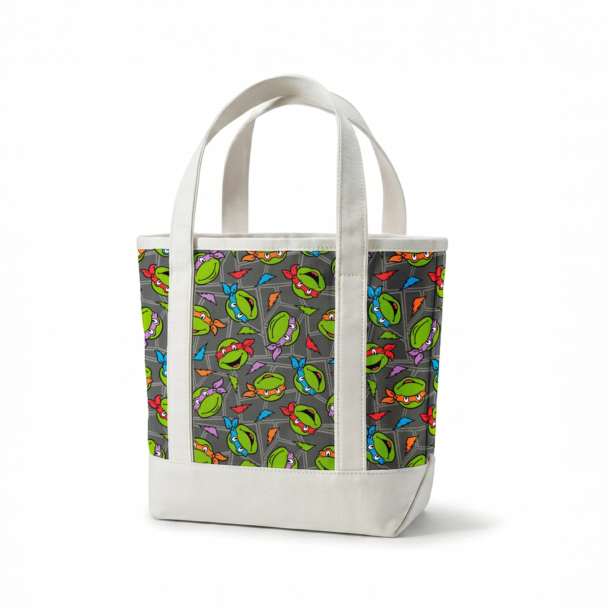 Colorful pattern of Teenage Mutant Ninja Turtles faces with red, orange, blue, and purple masks on grey background. springs canvastote mockup
