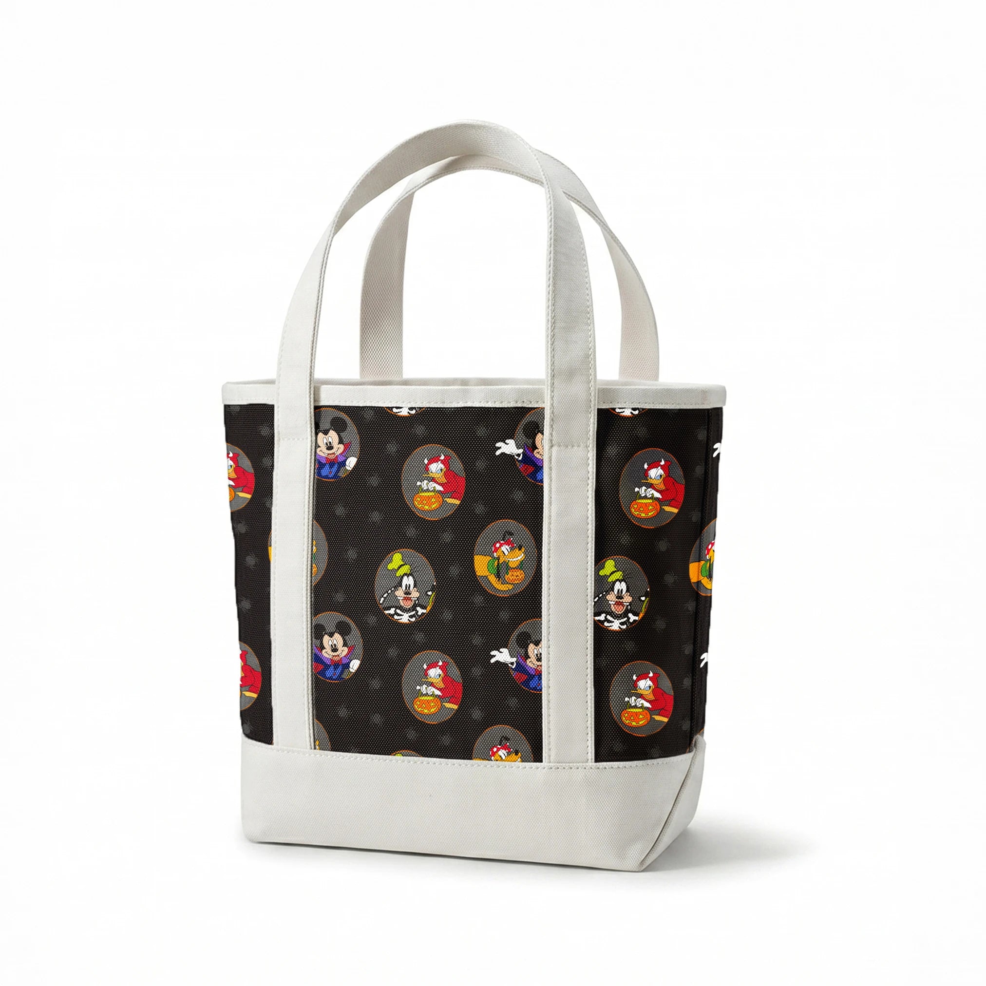 Disney characters in Halloween costumes on black background with spider pattern. Mickey as vampire, Donald with pumpkin, Pluto with candy. springs canvastote mockup