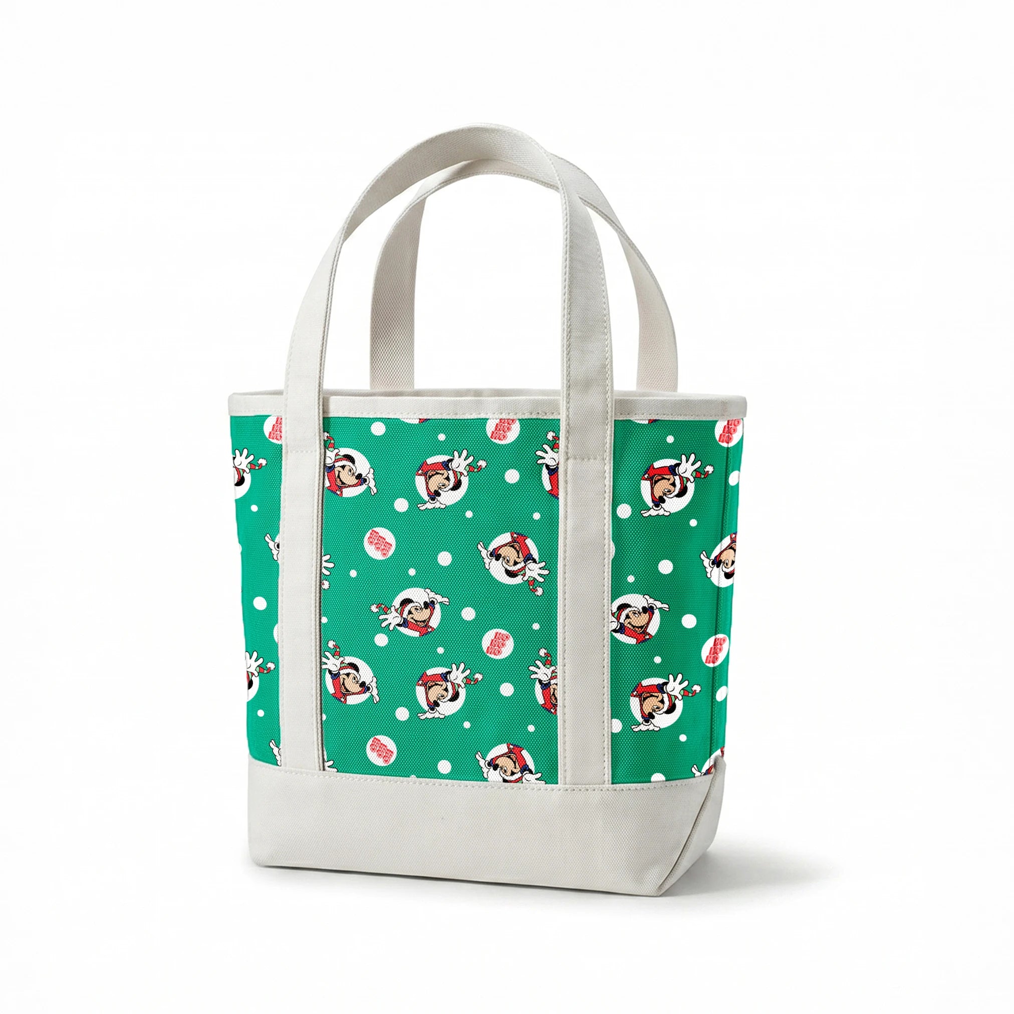 Mickey Mouse in Santa hats on green polka dot background with "Ho Ho Ho" text springs canvastote mockup