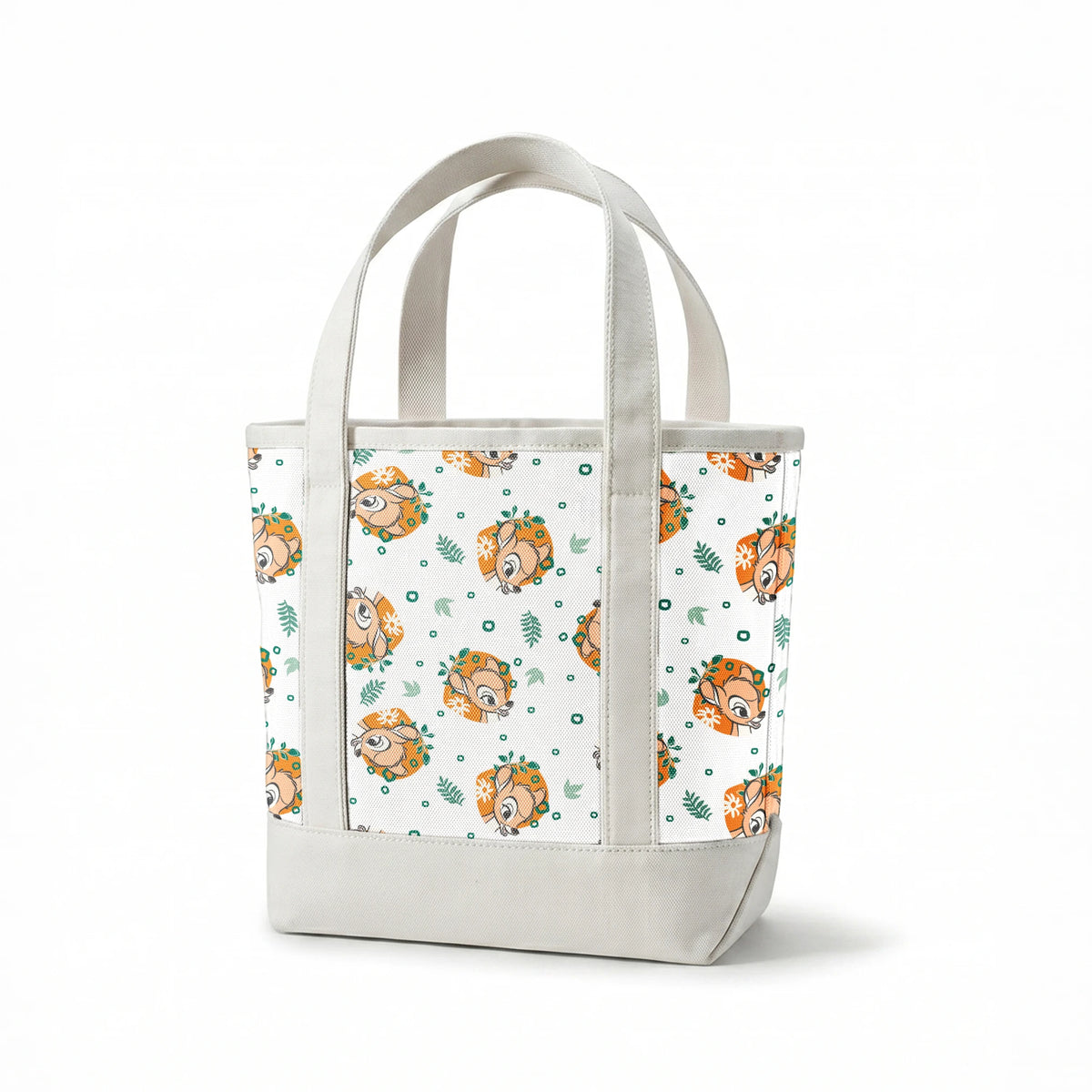 Disney’s Bambi illustrated in golden-orange floral medallions with green leaves and scattered geometric accents on a white background. springs canvastote mockup