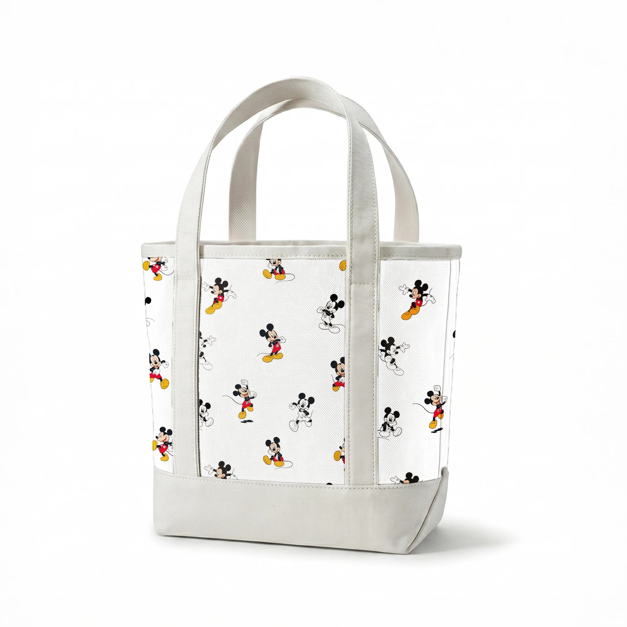 Repeating pattern of Mickey Mouse cartoon characters in various poses on white background springs canvastote mockup