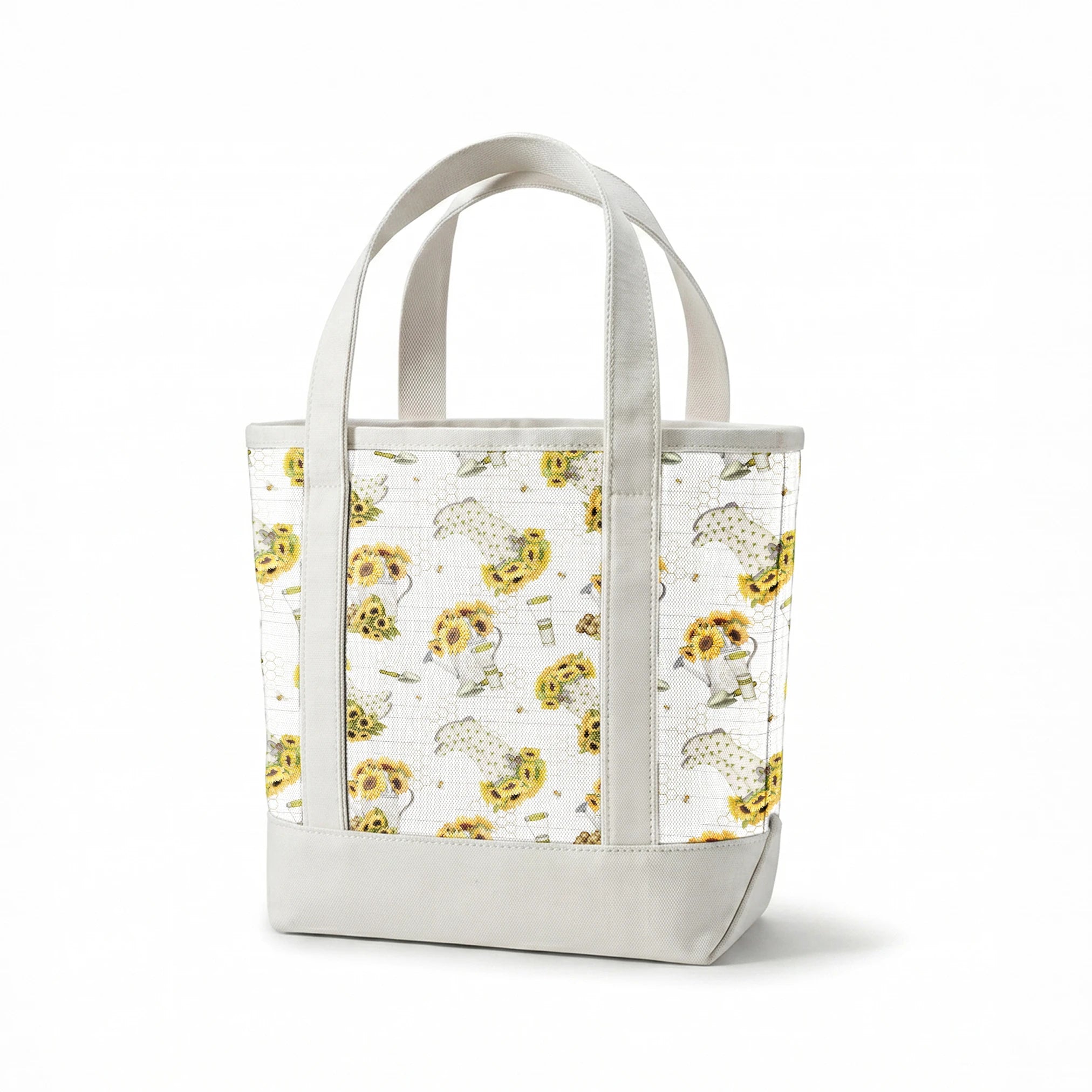 Sunflower-filled watering cans with bees, trowels, and garden tools on a white shiplap and honeycomb background. Designed by Nicole Tamarin. springs canvastote mockup