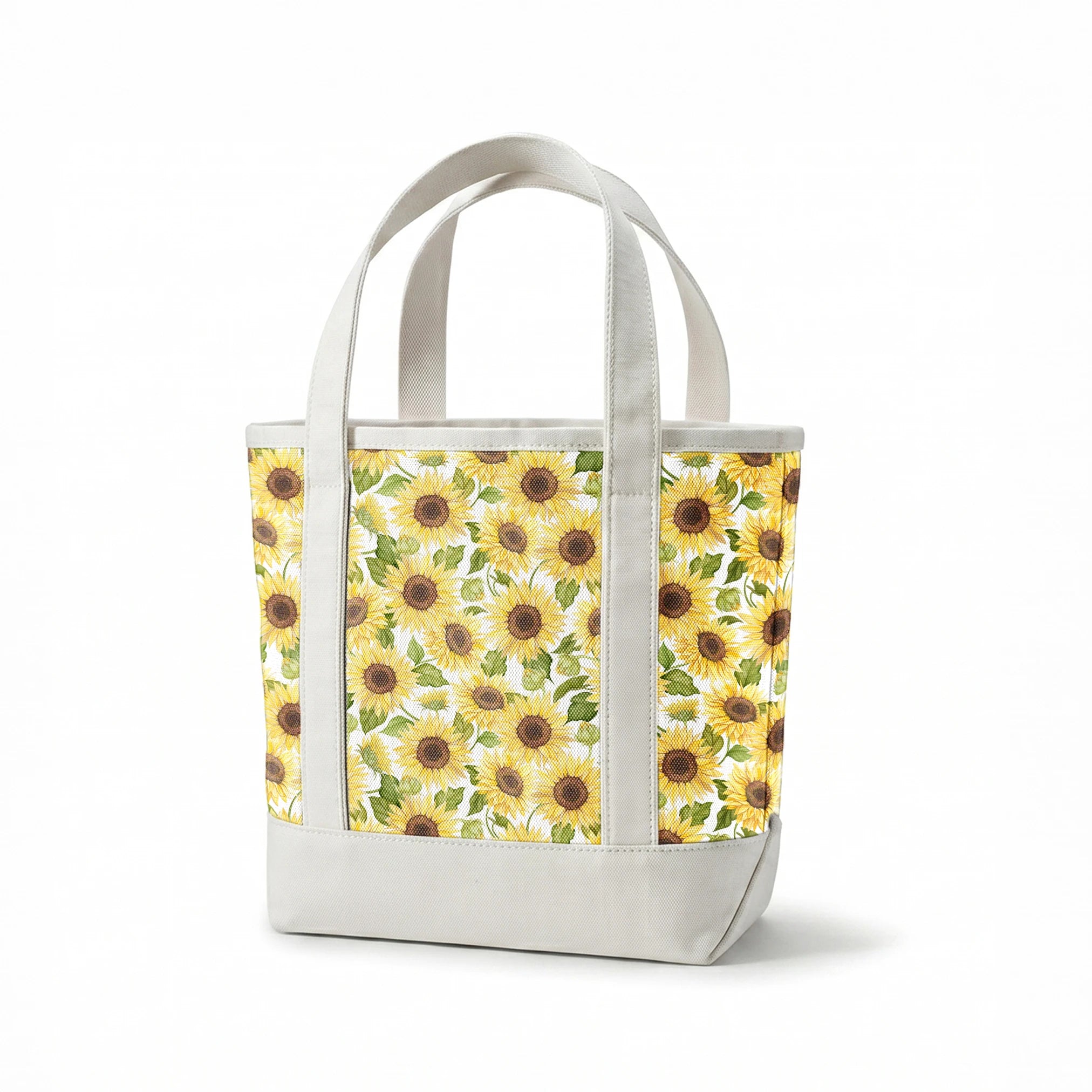 Watercolor-style packed sunflower pattern with yellow blooms and green leaves on a white background, designed by Nicole Tamarin. springs canvastote mockup