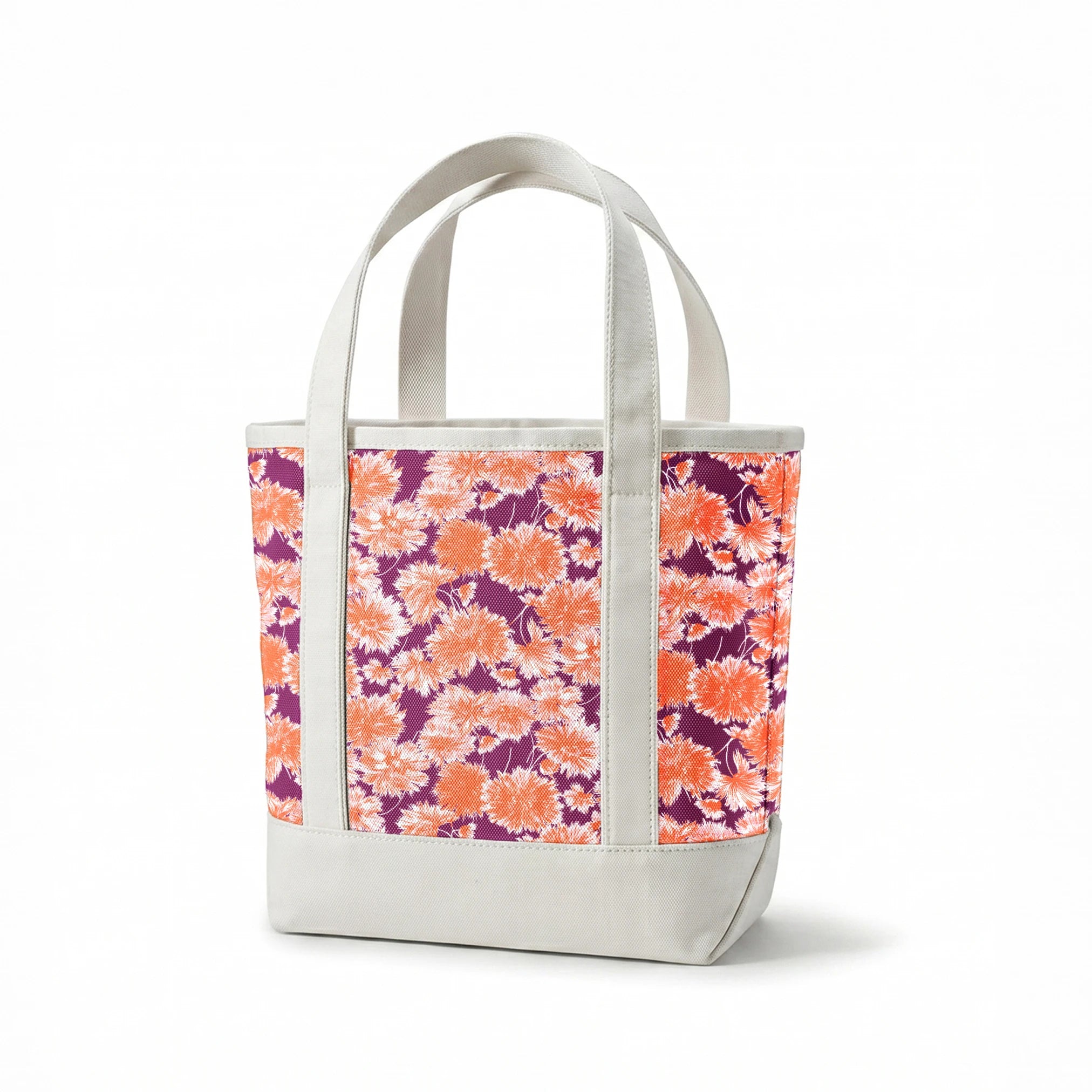 Vibrant floral pattern with orange and white chrysanthemum-like blooms on deep purple background springs canvastote mockup