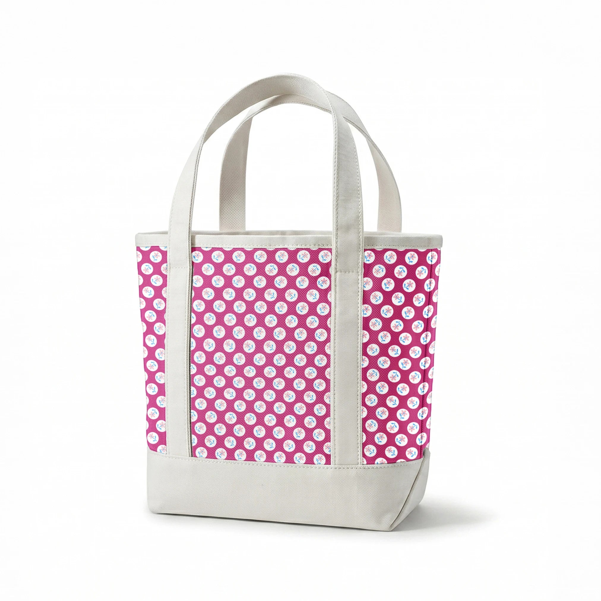 White circular dots with pink flowers and blue leaves pattern on vibrant magenta background springs canvastote mockup