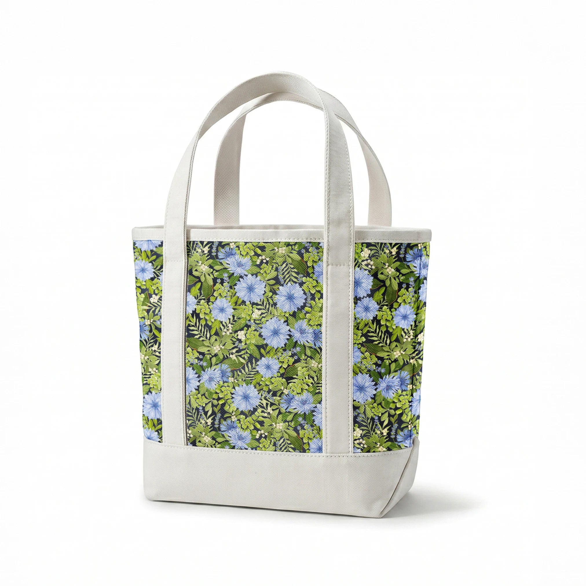 Beautiful floral pattern with light blue cornflowers and vibrant green leaves and foliage springs canvastote mockup