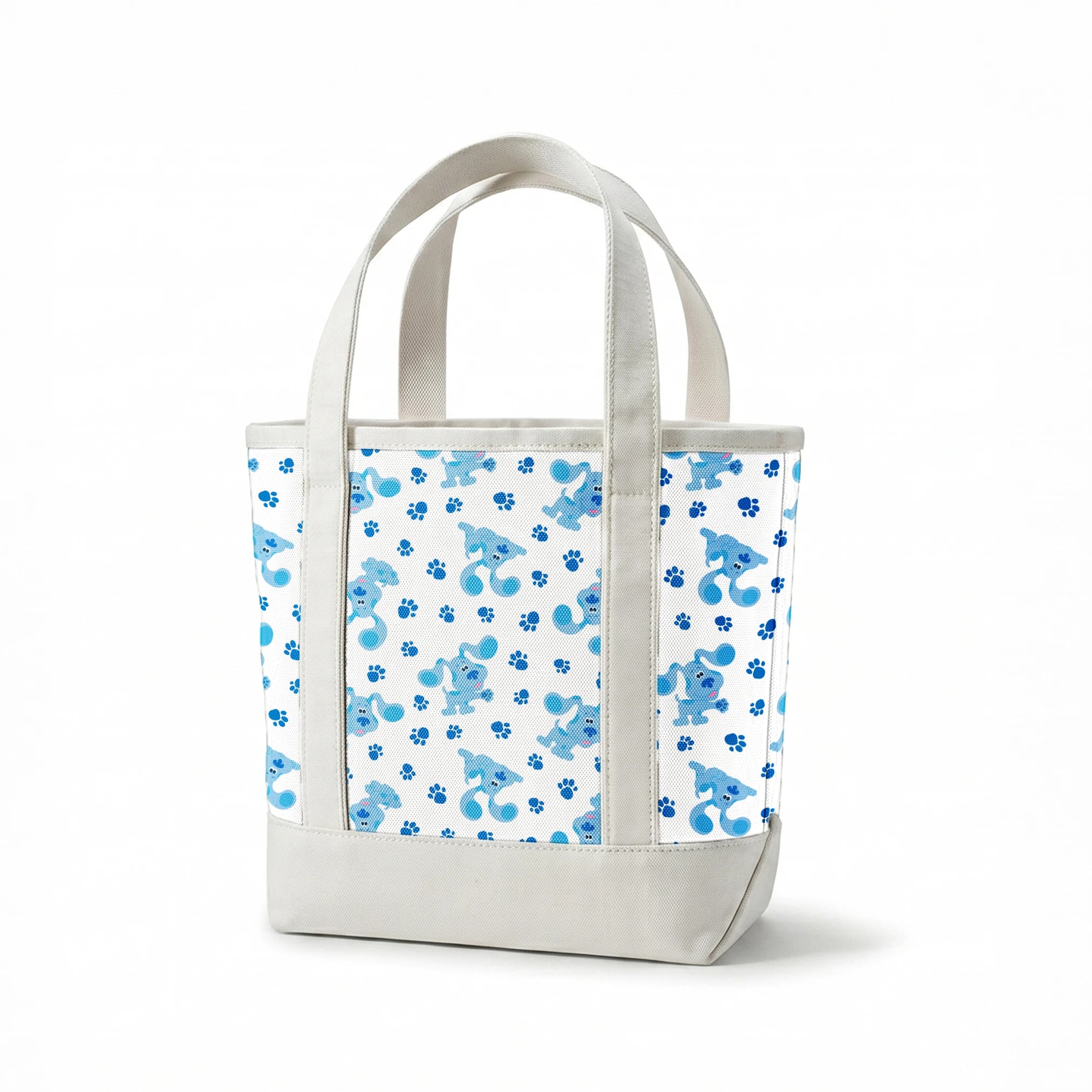 Blue cartoon puppies with floppy ears scattered among paw print pattern on white background springs canvastote mockup