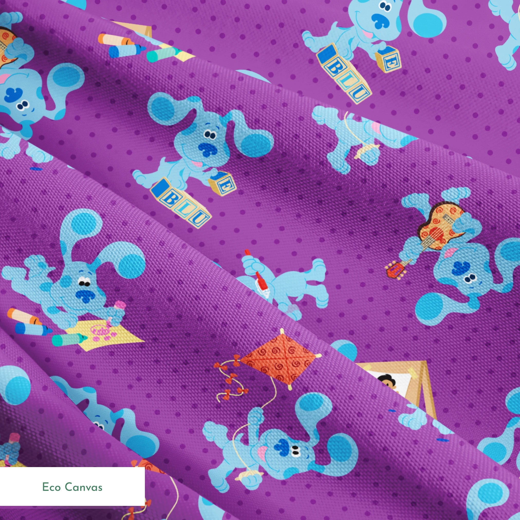 Blue cartoon dog characters on purple polka dot background with toys and alphabet blocks pattern springs ecocanvas texture