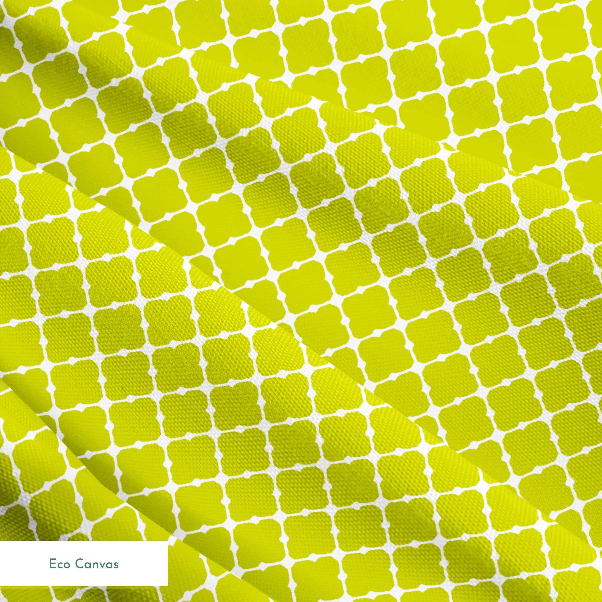 Chartreuse green quatrefoil pattern on white background, forming a geometric lattice design springs ecocanvas texture