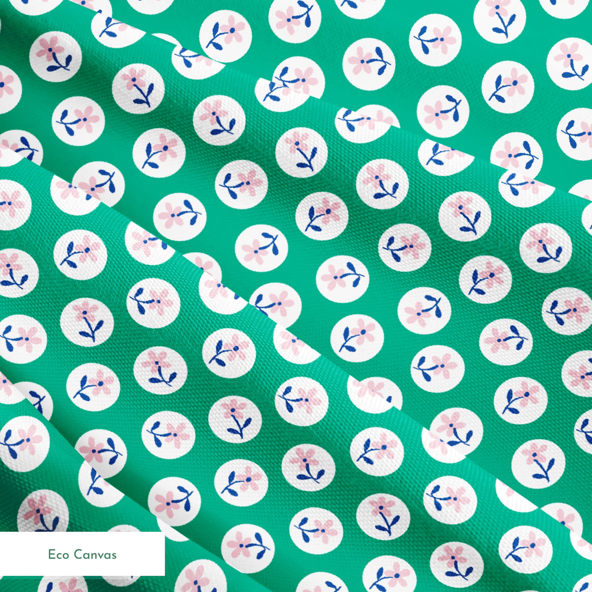 Pink flower motifs with blue stems on white circles against a green background springs ecocanvas texture