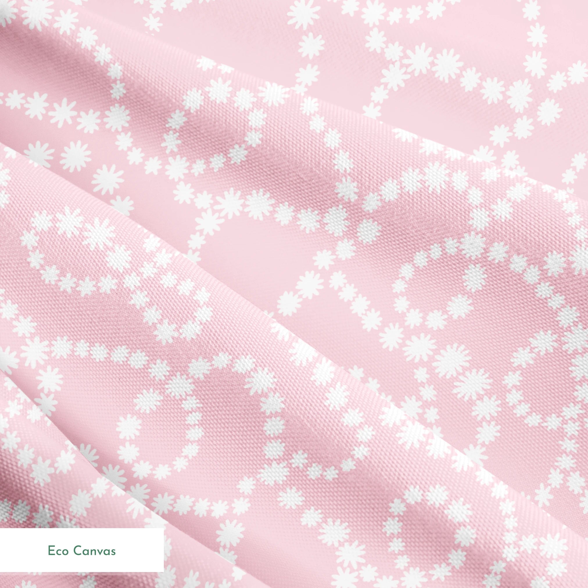 Baby pink background with white dotted swirling pattern creating delicate curved lines and loops springs ecocanvas texture