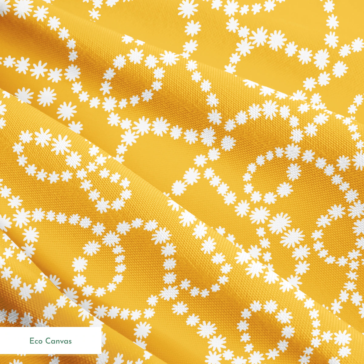 Mustard yellow background with swirling dotted white patterns forming organic circular designs springs ecocanvas texture