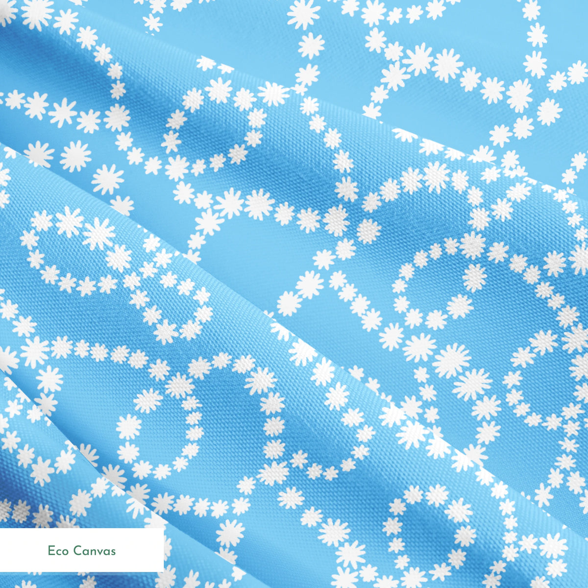 Sky blue background with swirling white dotted pattern resembling beaded strings or pearls arranged in curving lines springs ecocanvas texture