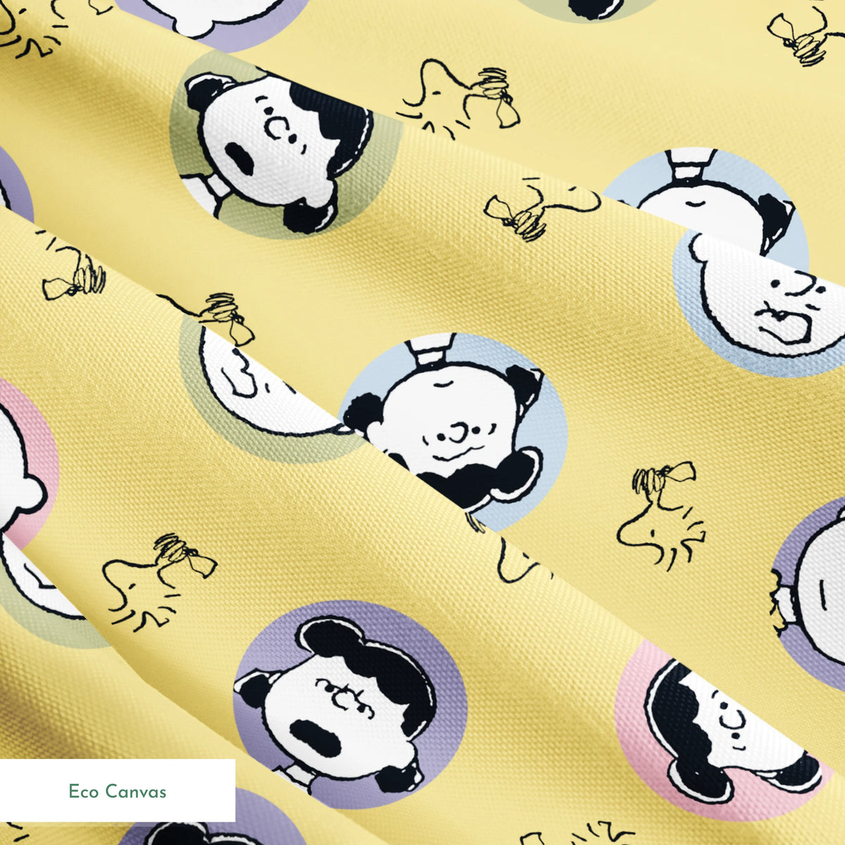 Peanuts characters pattern with Charlie Brown and friends in circular frames on yellow background with Woodstock silhouettes springs ecocanvas texture
