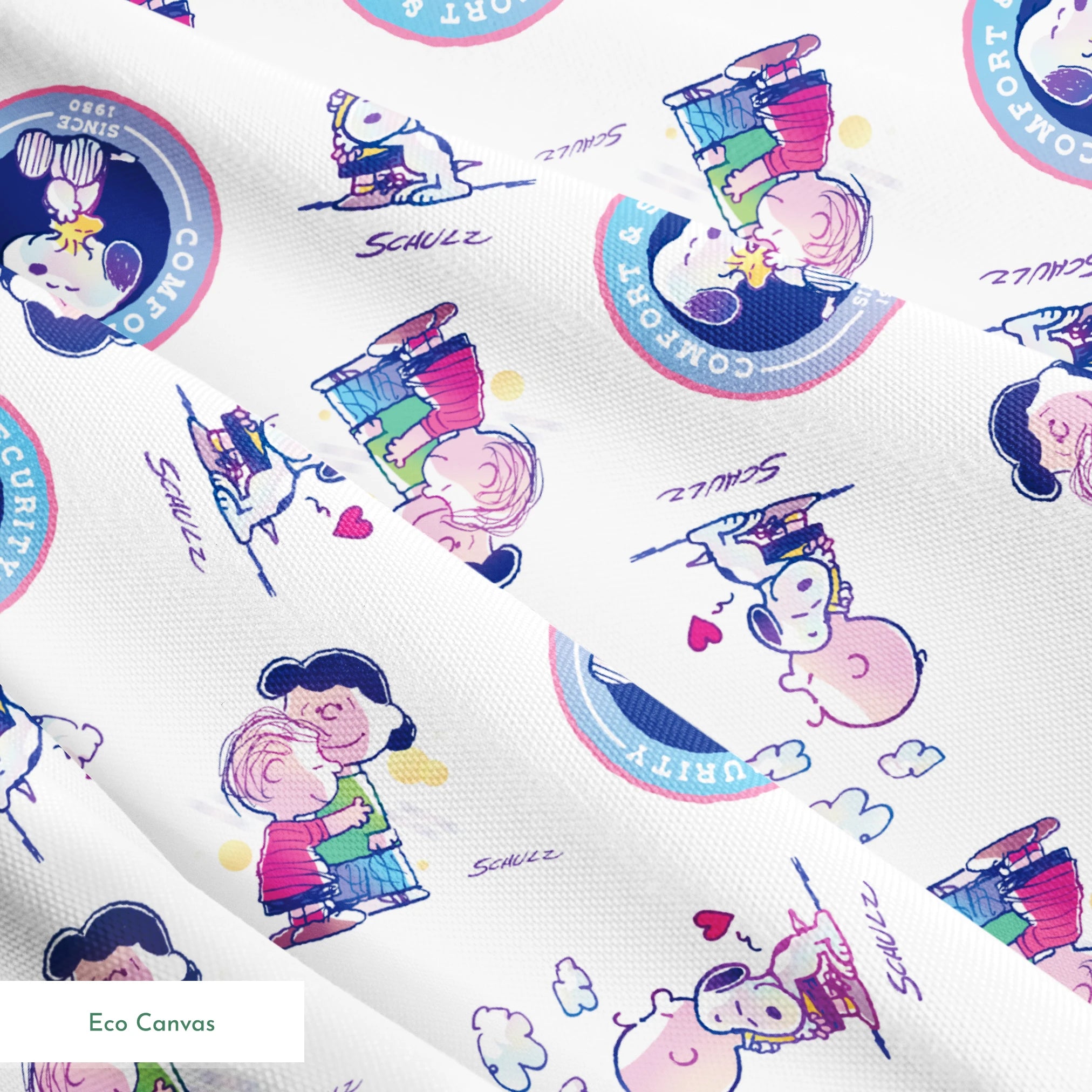 Peanuts cartoon pattern with Snoopy in blue circles and Charlie Brown with books on white background springs ecocanvas texture