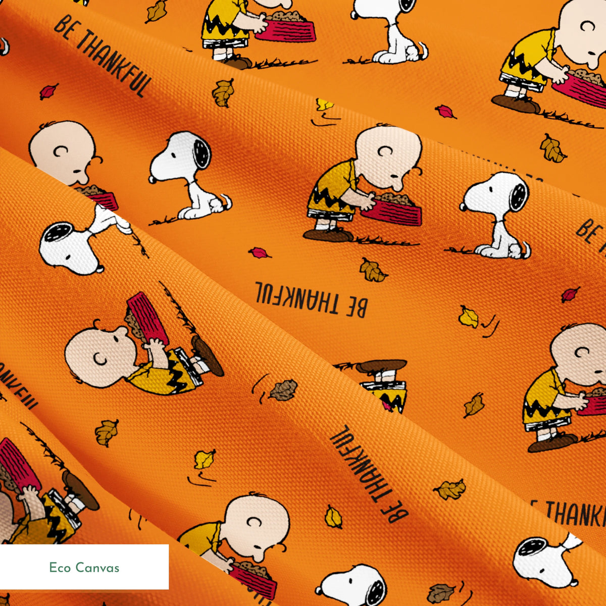 Peanuts characters on orange background with autumn leaves and "Be Thankful" text pattern springs ecocanvas texture