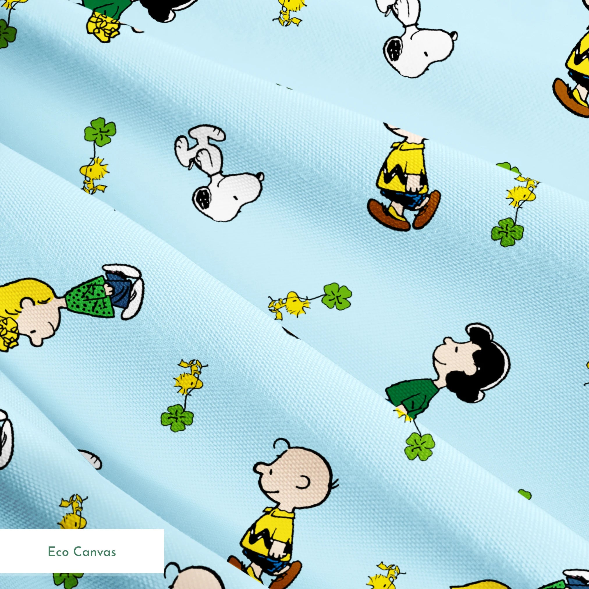 Peanuts cartoon characters on light blue background with clovers springs ecocanvas texture